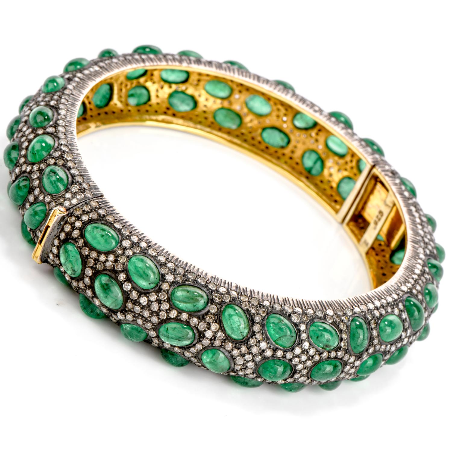 This Handmade bangle Bracelet reflects Style and Taste in sterling silver and 18k Gold!

Adorning all around this bangle are 80 cabochon emeralds weighing approx. 36.77 carats, also bangle covered with genuine natural diamonds I-J color, SI2-I