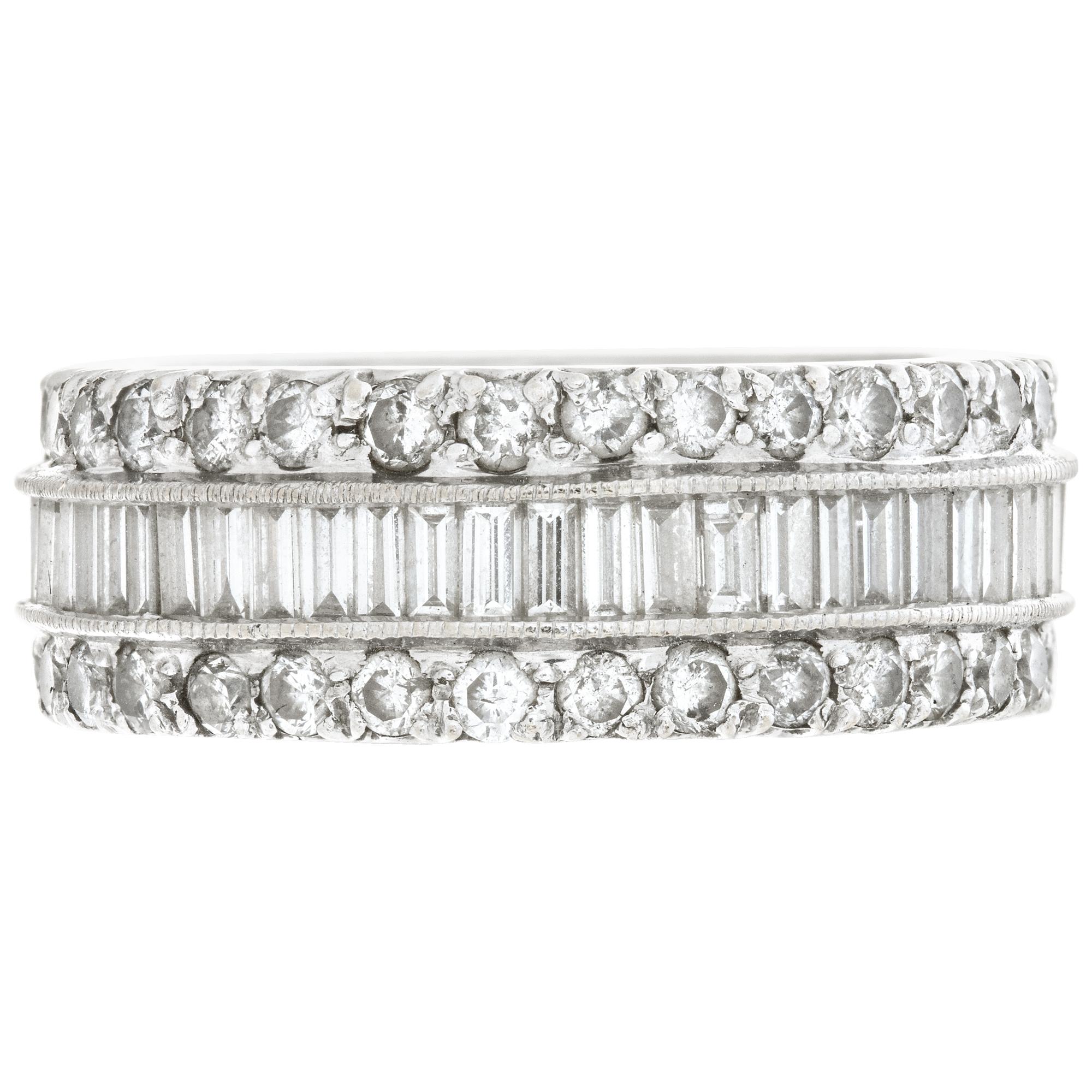 Eternity diamonds ring with approx 4.50 carats emerald and round brilliant cut diamonds set in 18K white gold. Diamonds estimate: G-H color, VS clarity. 8mm wide. Size 6.75
