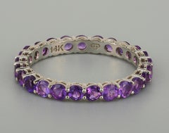 Eternity gold ring with amethysts.