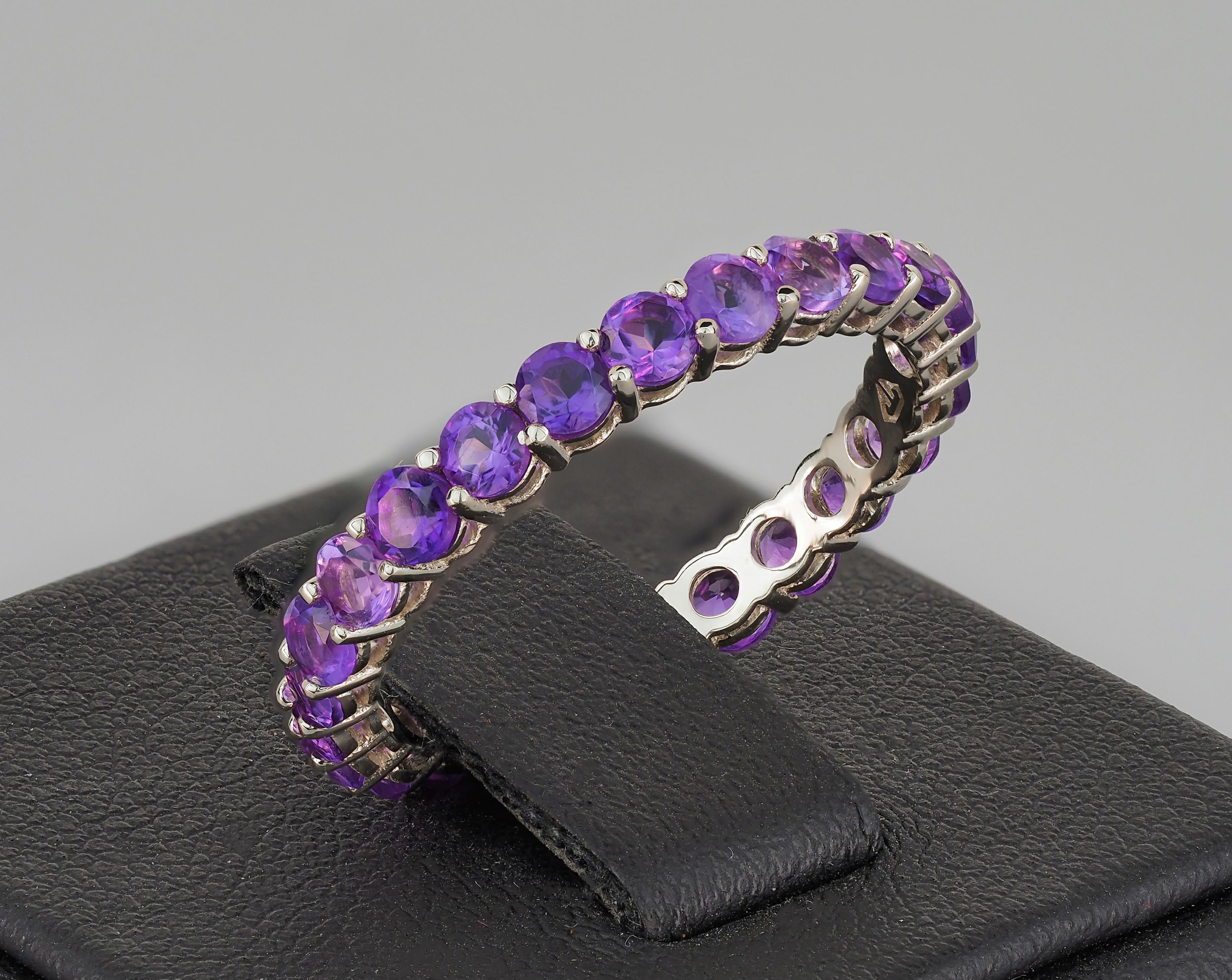 Round Cut Eternity gold ring with amethysts. 