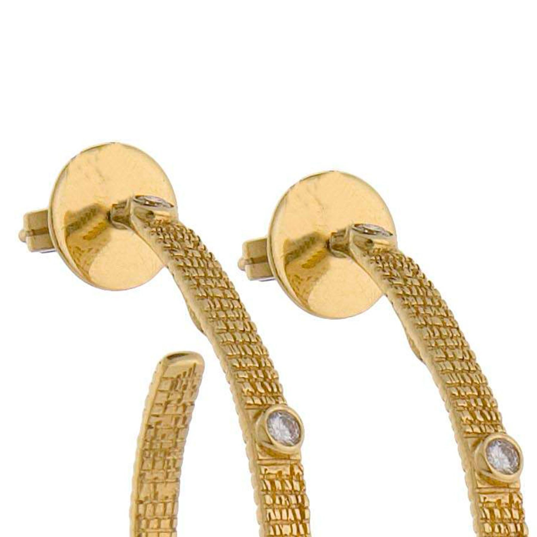 Hoop Earrings Set in 20 Karat Yellow Gold with Hammered Wire Gold Texture and 0.52-carat Rose-Cut Diamonds. This is part of COOMI's Eternity Collection which is inspired by the flow of movement of different shapes such as circles, wire, coils, and
