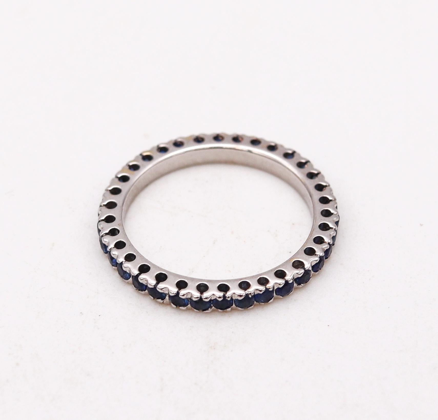 Eternity ring with round Blue Sapphires.

Contemporary full band ring, crafted in solid white gold of 18 karats, with high polished finish. It is mounted in a single row of prongs, with 36 calibrated round brilliant cuts of vivid Blue Sapphires

The