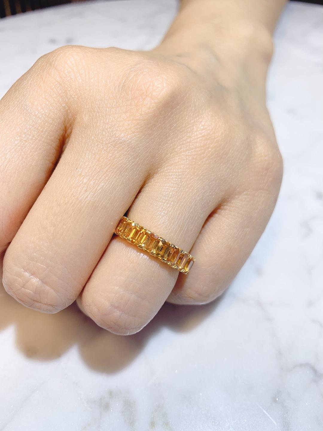 Contemporary Eternity Orange Sapphire Ring in Yellow Gold For Sale
