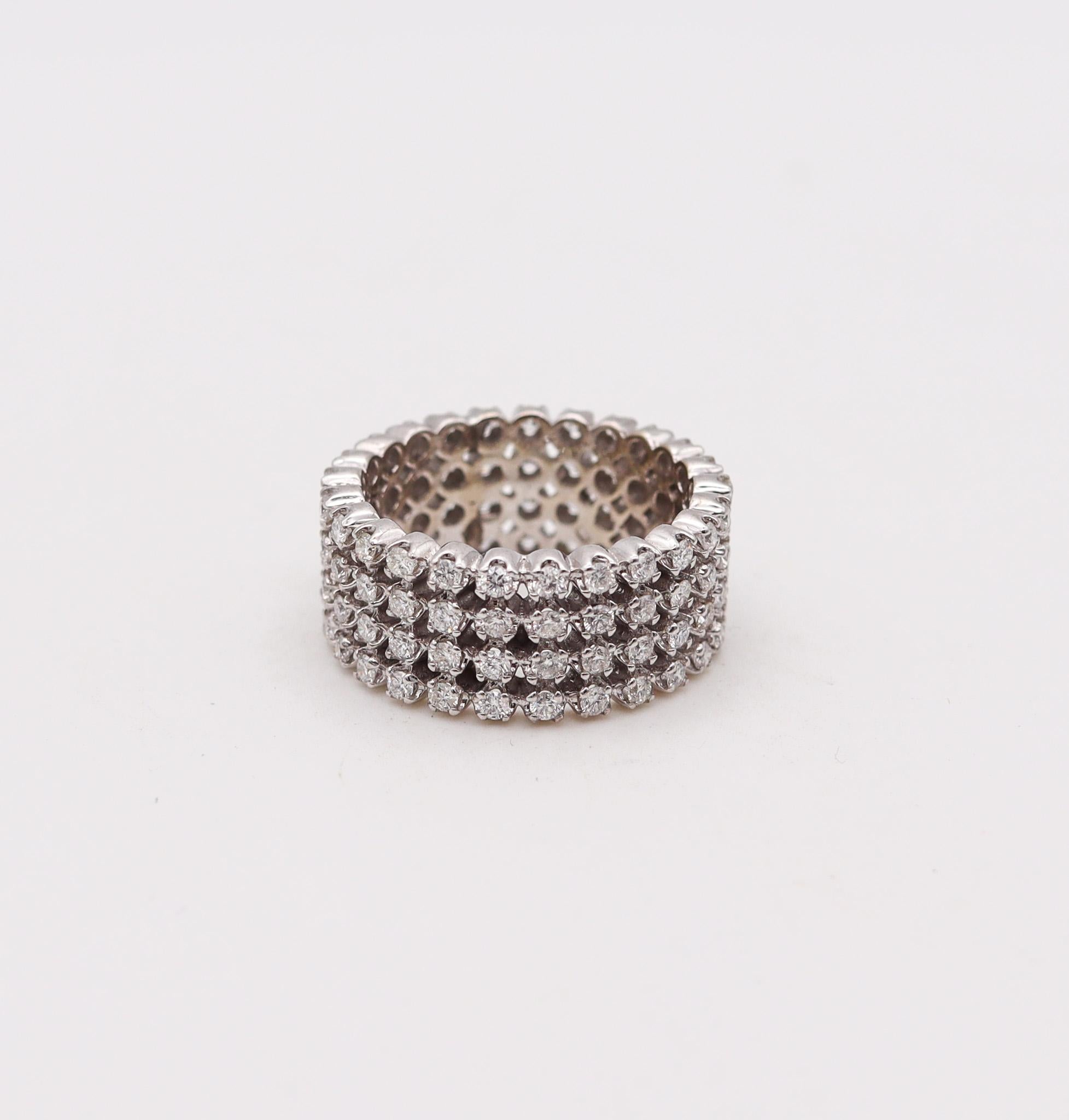 A quadruple eternity ring band with Natural diamonds.

Modernist eternity quadruple full four ring band made in Italy. This unusual eternity ring was crafted with a bold and thick solid look in solid white gold of 18 karats with high polished