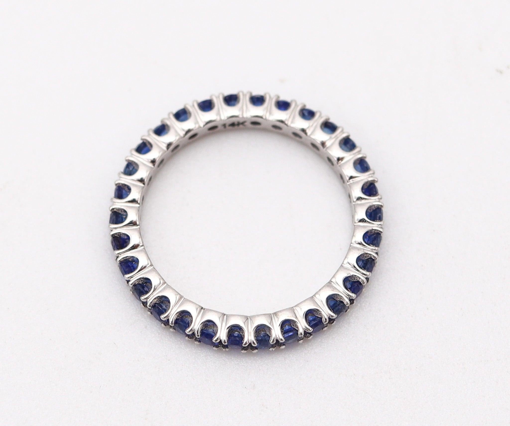 Modernist ETERNITY Ring Band In 14Kt White Gold With 1.08 Ctw In Vivid Blue Sapphires For Sale
