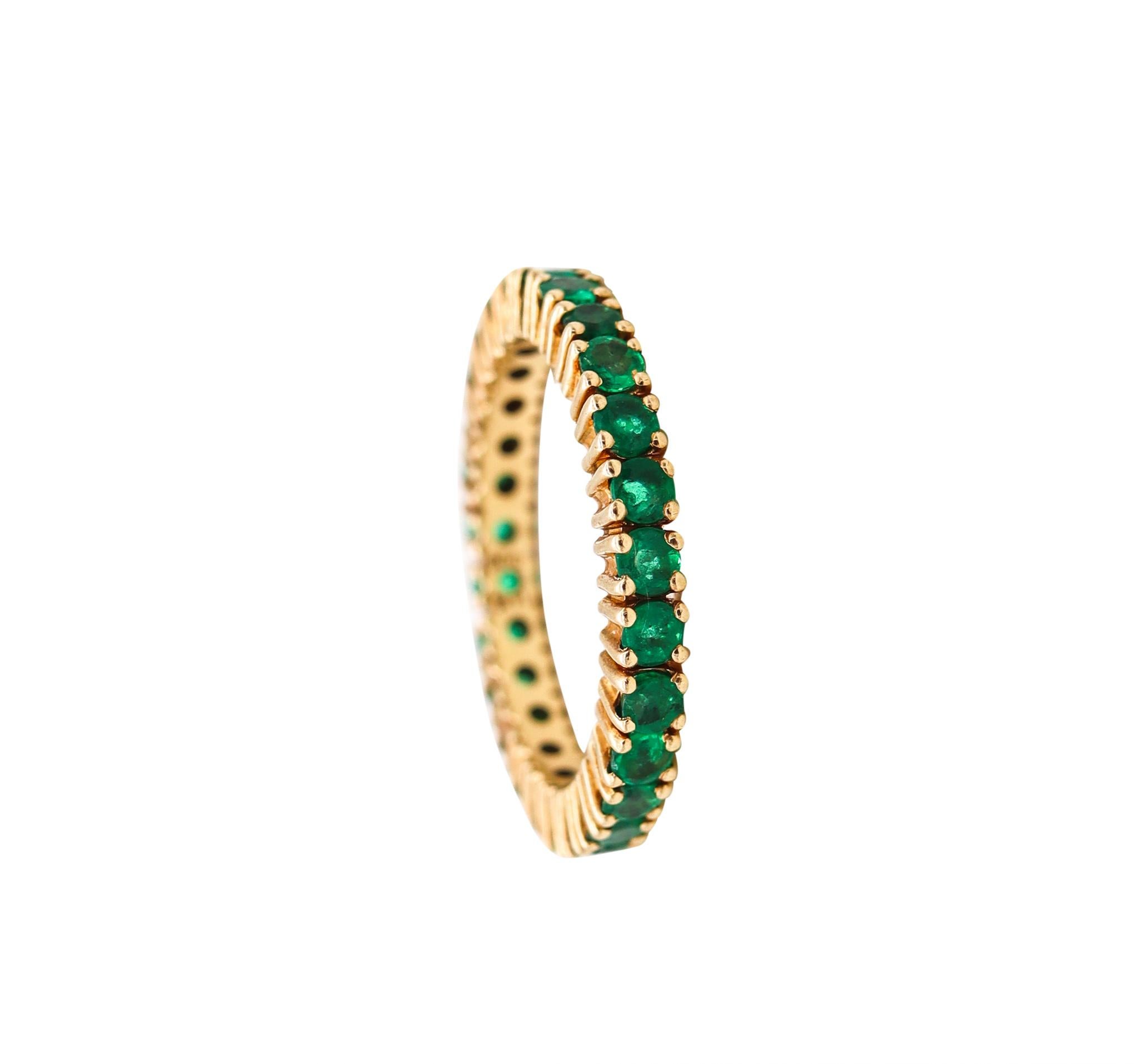 Eternity ring with Colombian Emeralds.

A modern full band carefully crafted in solid yellow gold of 14 karats, with high polished finish. It is mounted in a prongs setting, with 27 calibrated round cuts of Colombian Green emeralds

The gemstones