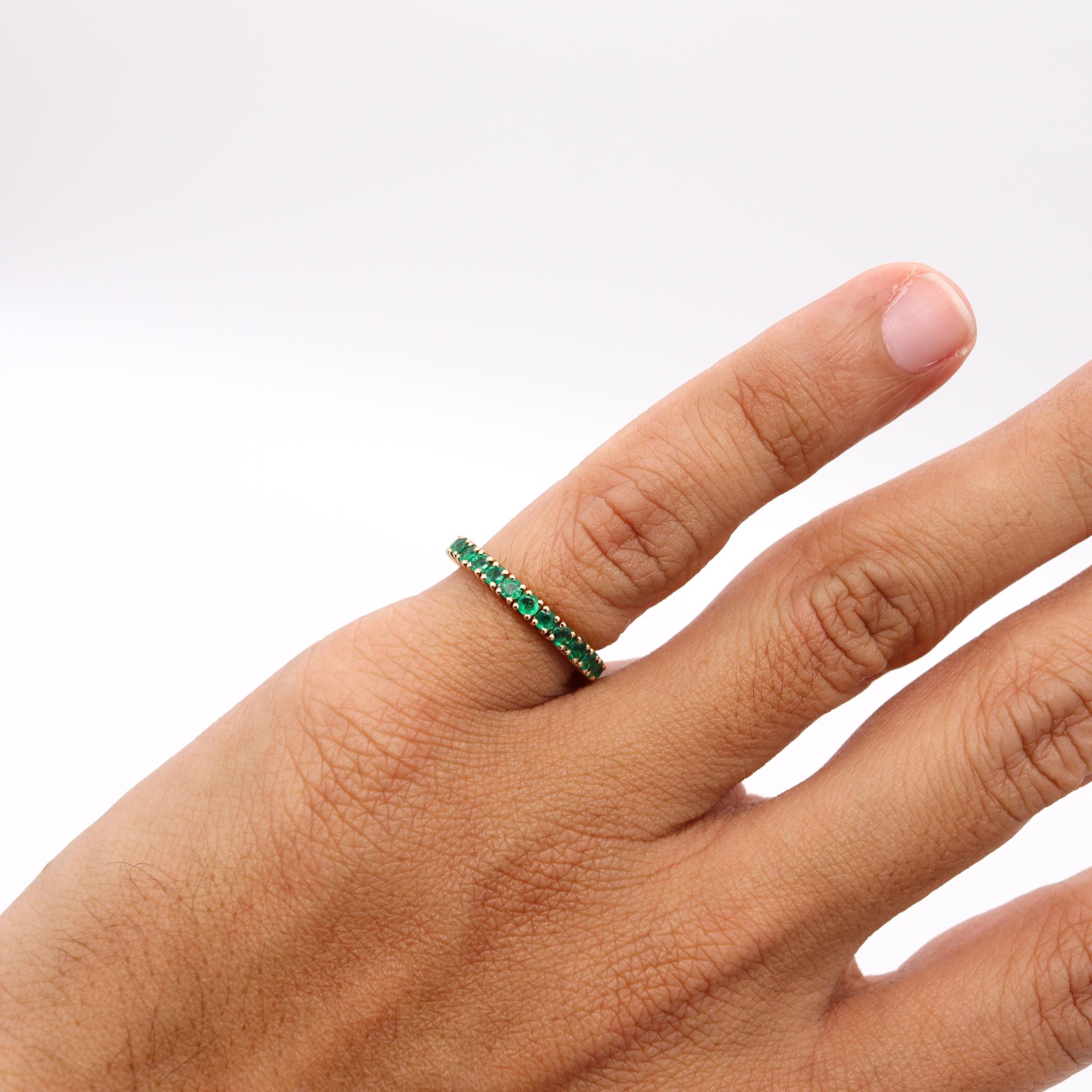 Modern Eternity Ring Band in 14Kt Yellow Gold with 1.62 Carats of Colombian Emeralds For Sale