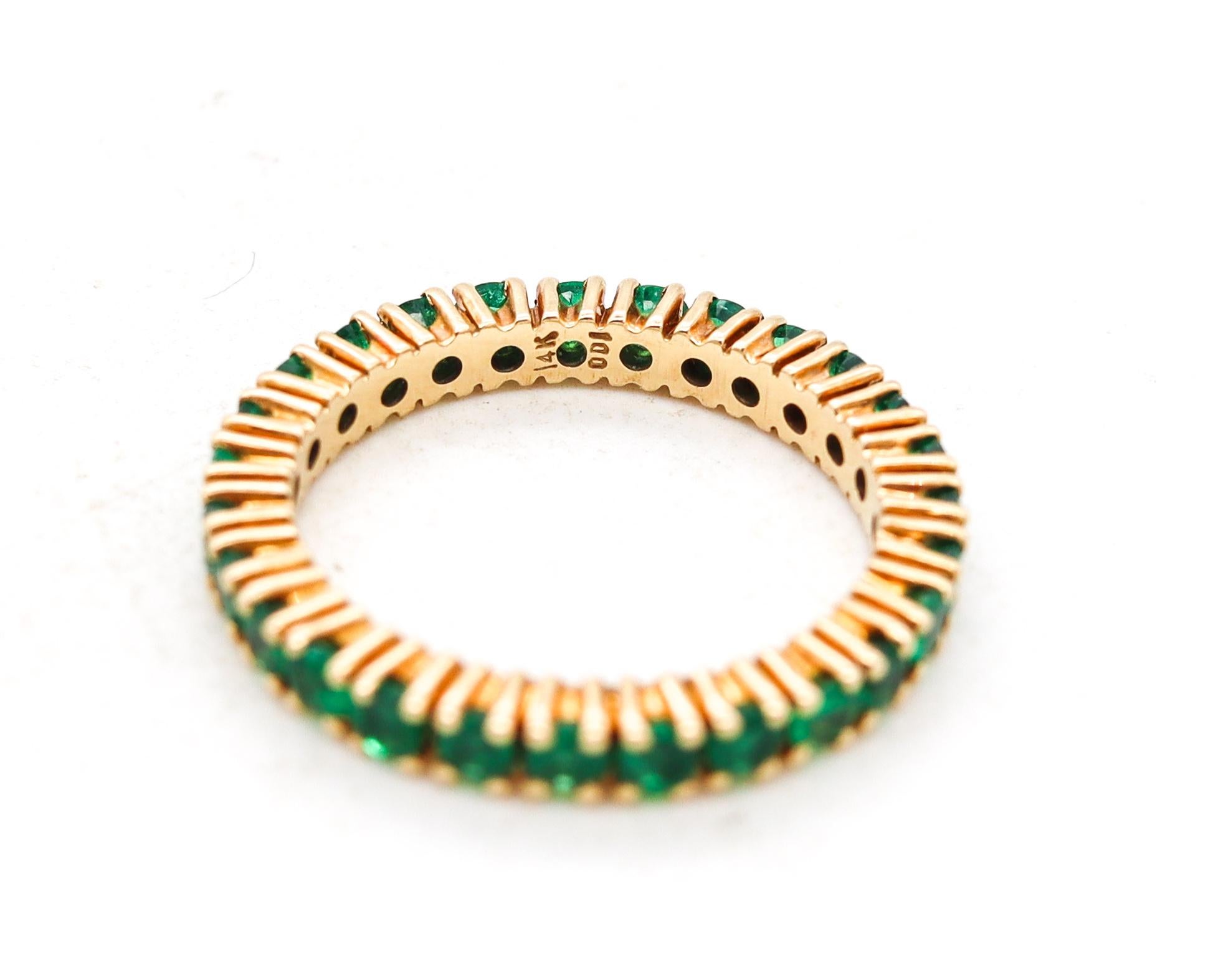 Round Cut Eternity Ring Band in 14Kt Yellow Gold with 1.62 Carats of Colombian Emeralds For Sale