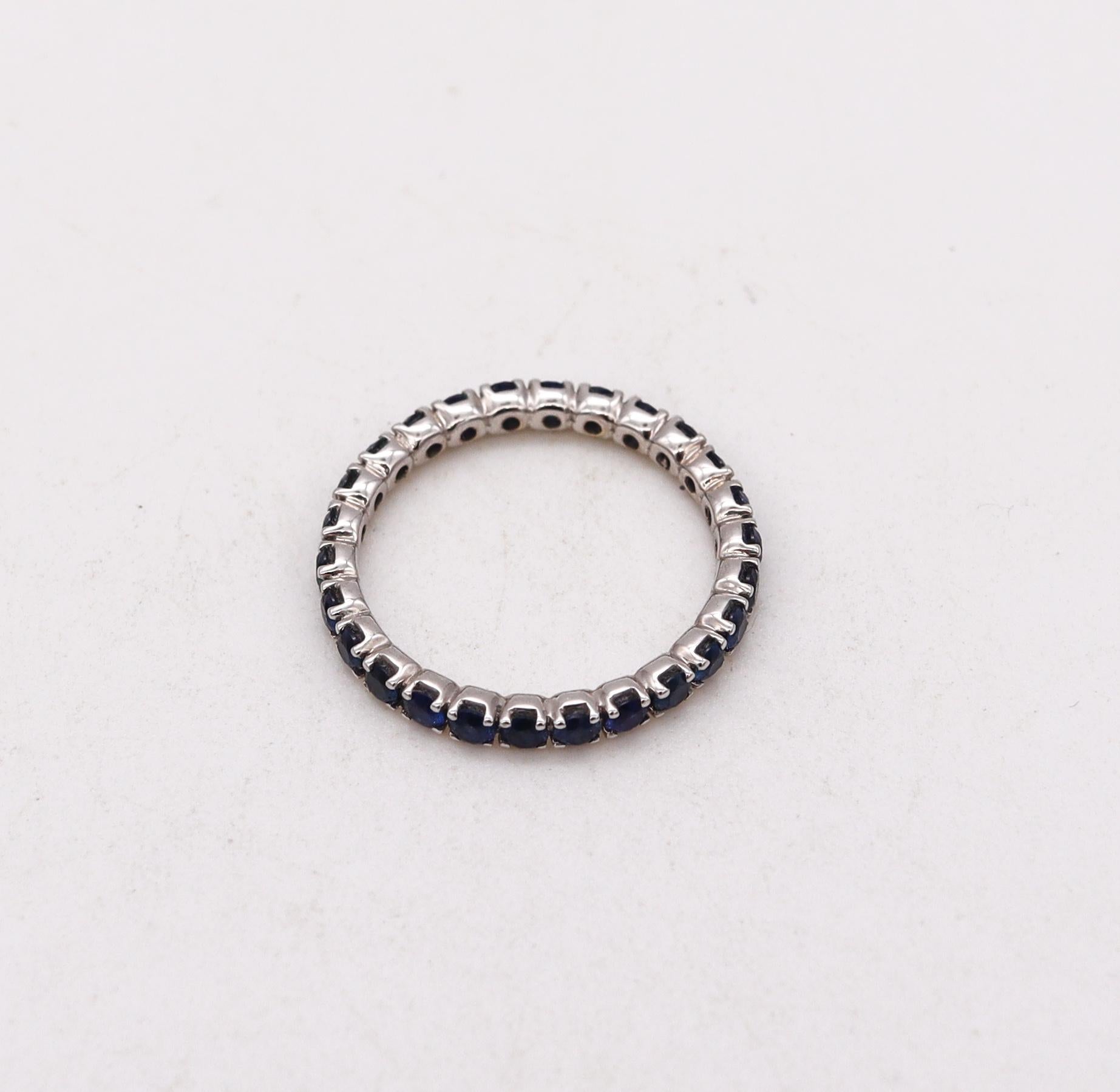 Eternity ring with Vivid Blue Sapphires.

Modern full band carefully crafted in solid white gold of 18 karats, with high polished finish. It is mounted in a single row of prongs, with 27 calibrated round brilliant cuts of Ceylon Blue Sapphires

The