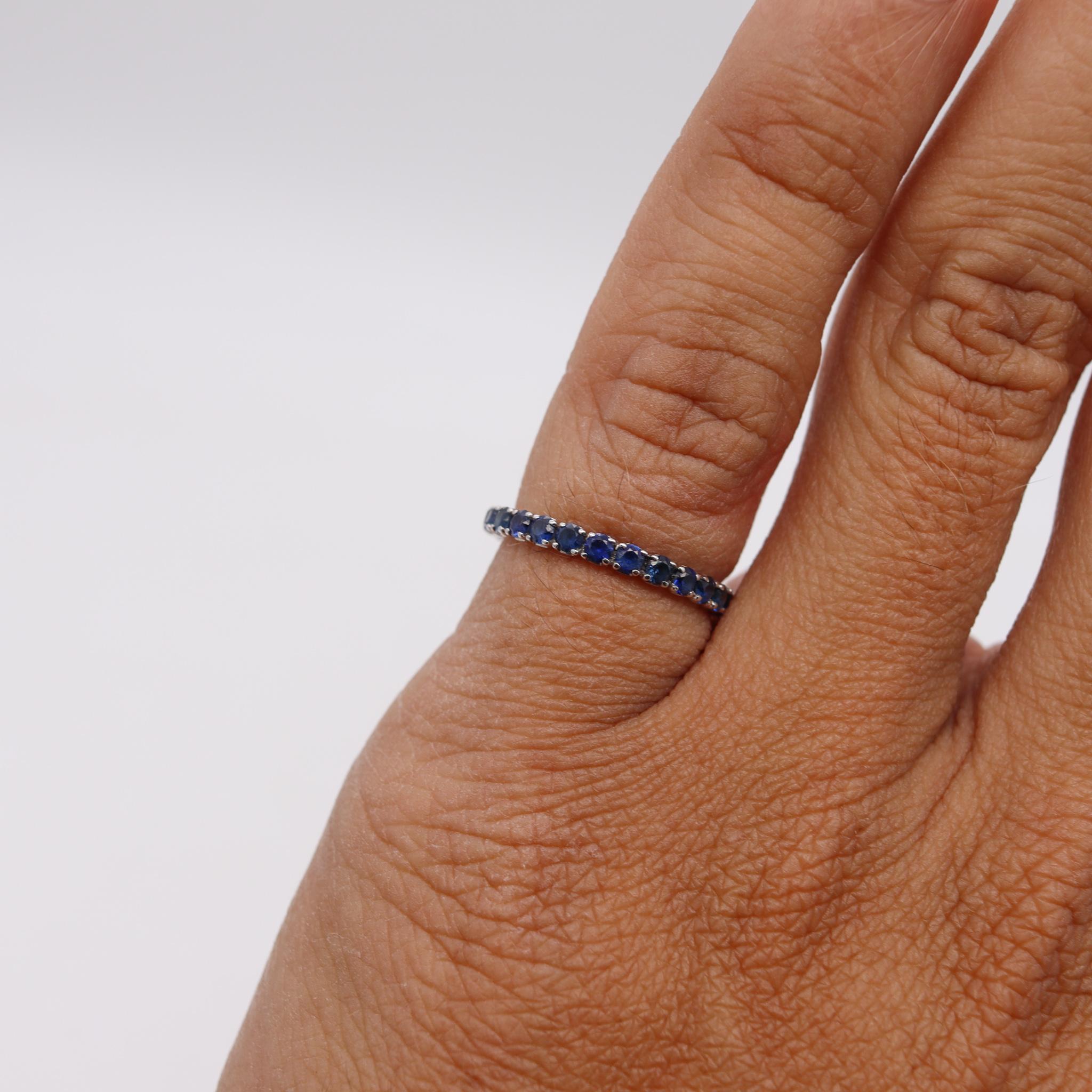 Brilliant Cut Eternity Ring Band in 18Kt White Gold with 1.25 Carats in Ceylon Blue Sapphires For Sale