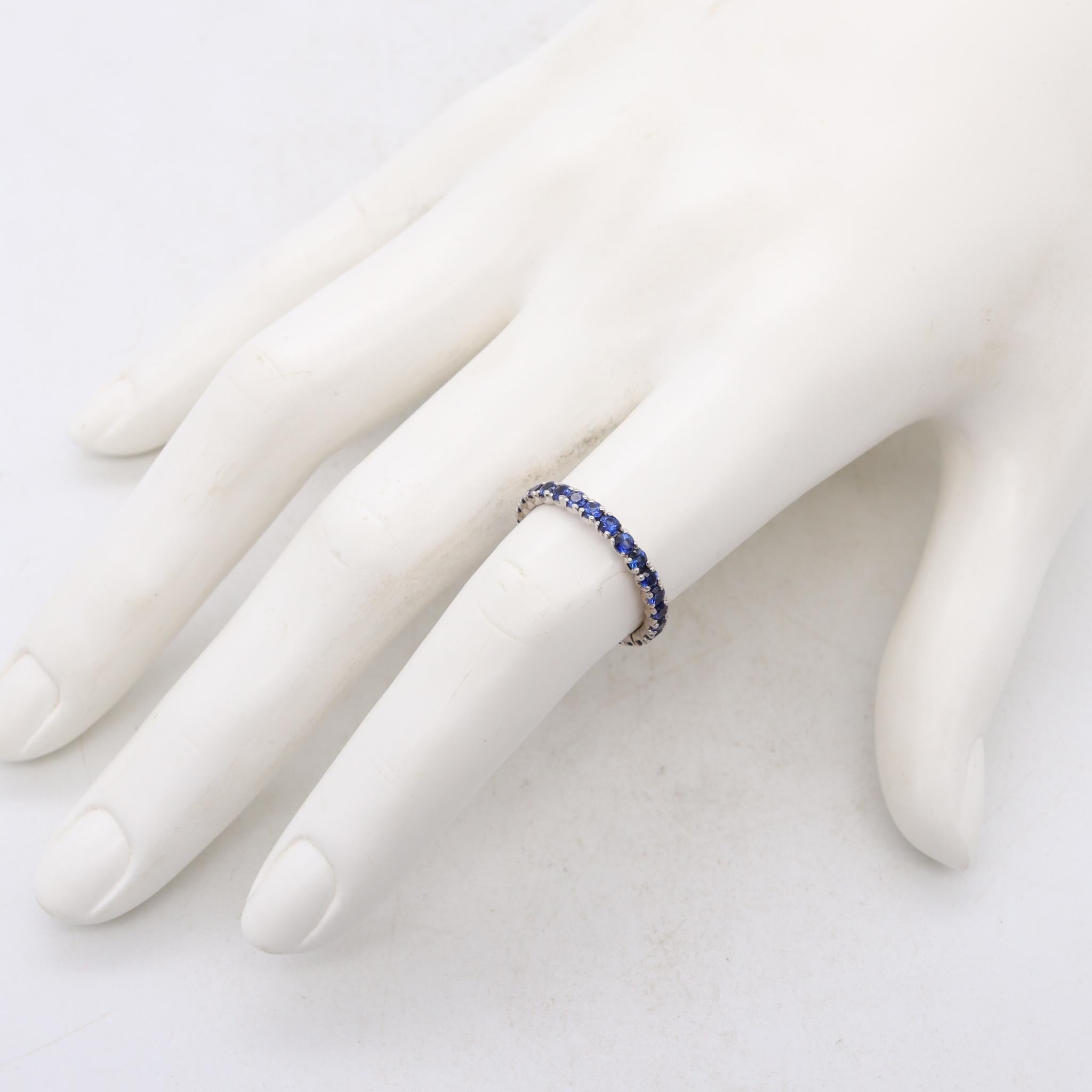 Modern Eternity Ring Band in 18kt White Gold with 1.35 Cts in Ceylon Blue Sapphires