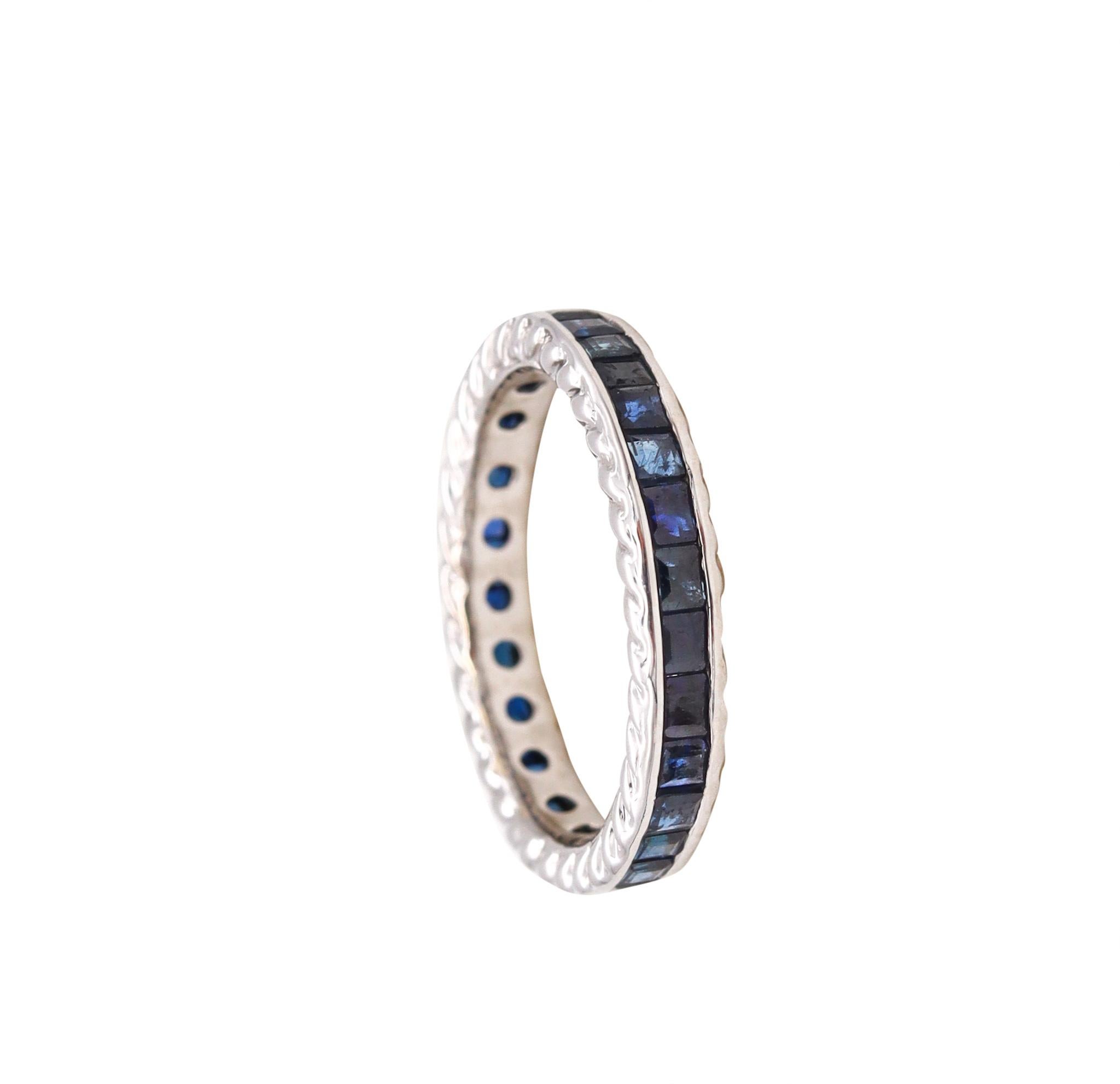 Eternity ring with Natural blue Sapphires.

A modern full band carefully crafted in solid white gold of 18 karats, with high polished finish and the sides decorated, with fluted patterns. It is mounted in a channel setting, with 32 calibrated