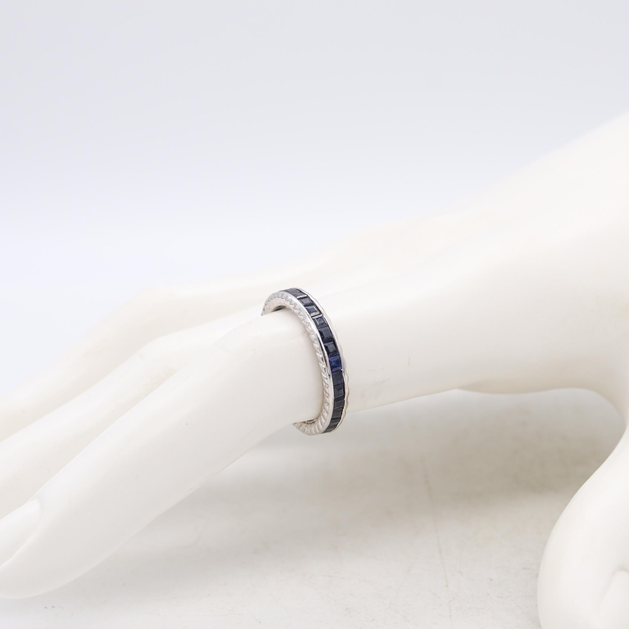 Princess Cut Eternity Ring Band in 18kt White Gold with 1.62 Carats in Blue Sapphires For Sale