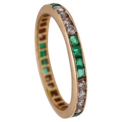 Eternity Ring Band in 18kt Yellow Gold with 1.28 Ctw in Diamonds and Emeralds