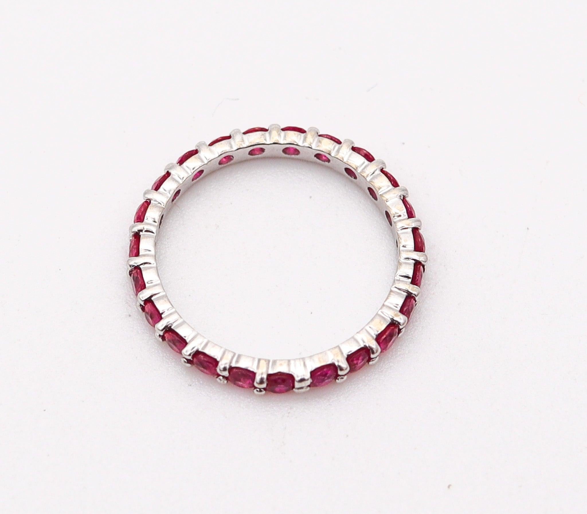 An eternity ring band with Natural Rubies.

This is a beautiful eternity ring carefully crafted in solid white gold of 18 karats with high polished finish and embellished around with a great selection of twenty-two round vivid red rubies.

Rubies: