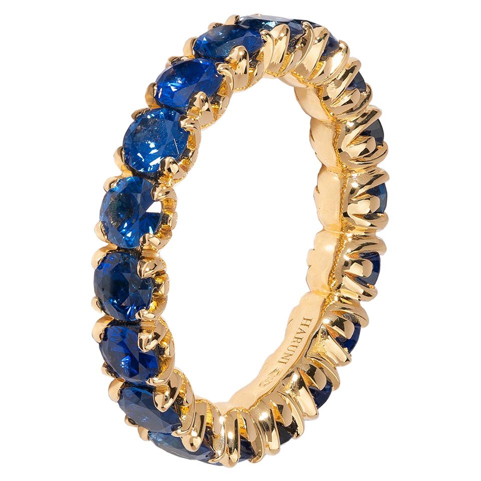 Eternity Ring With Royal Blue Sapphires in 18 Karat Yellow Gold For Sale