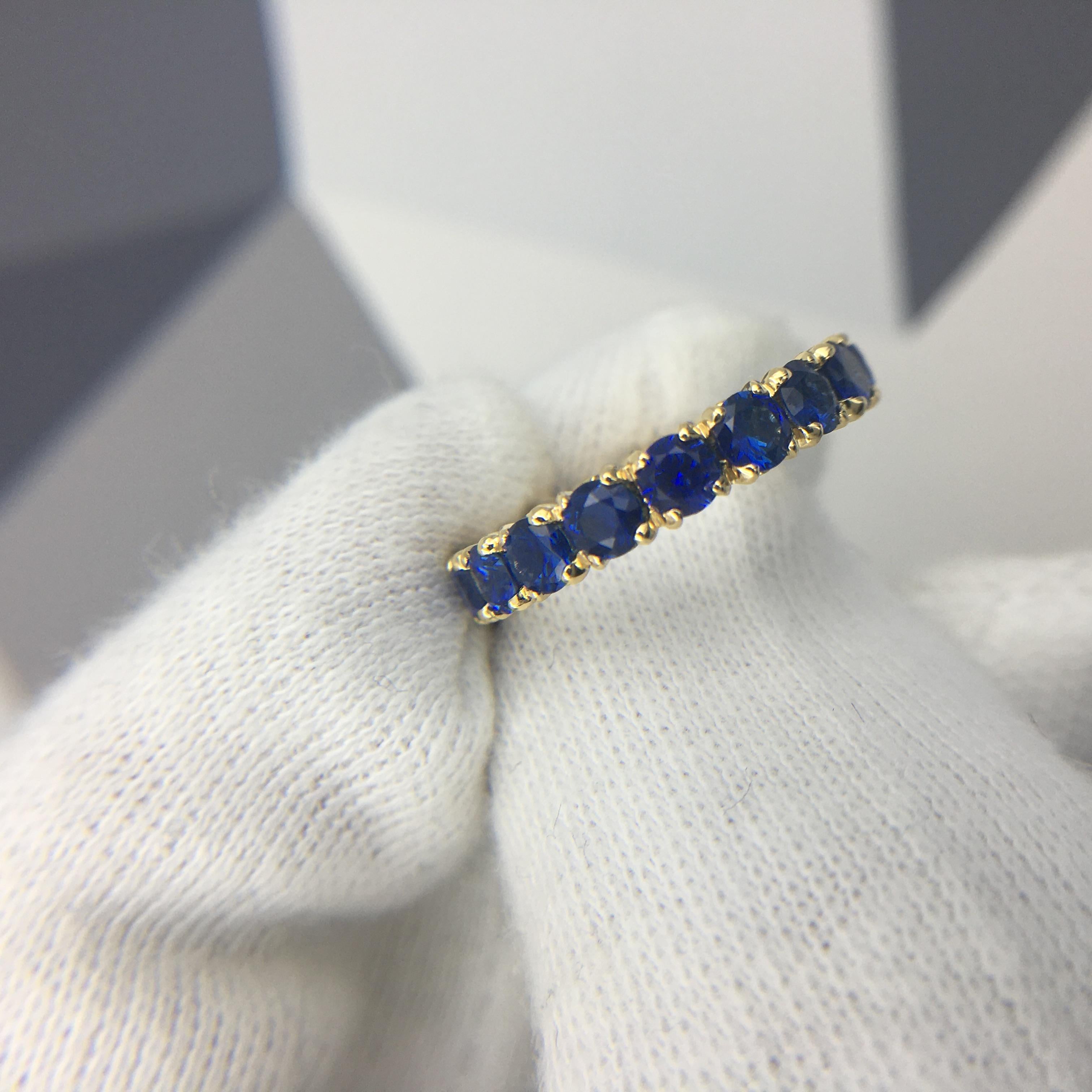 Round Cut Eternity Ring With Royal Blue Sapphires in 18 Karat Yellow Gold For Sale