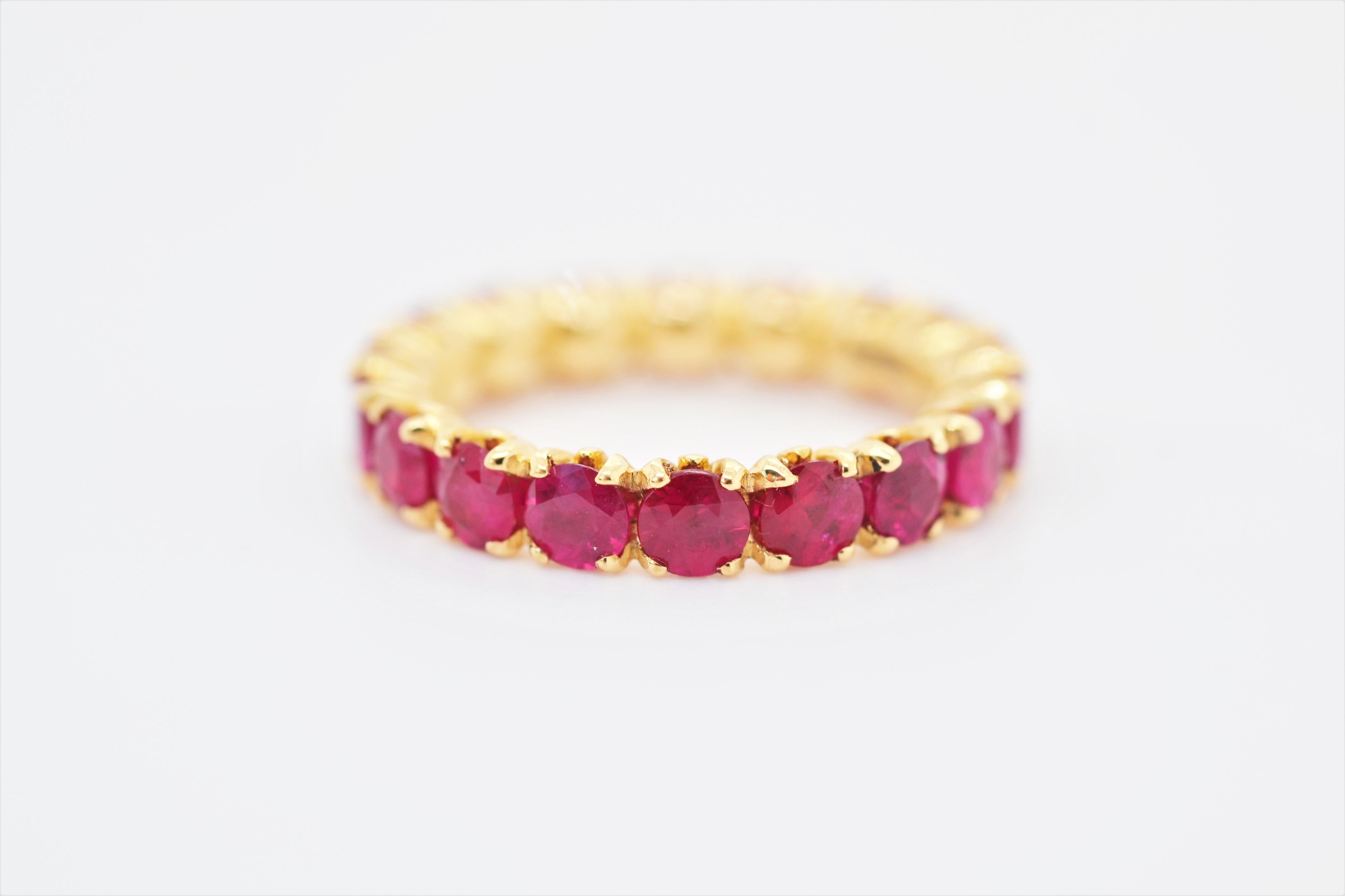 This elegant blossom eternity ring combines beauty and style. It can be worn both casually, or more formally and can be worn on its own, or layered with other rings. The rubies are set in 18k yellow gold, in the blossom collection’s flower