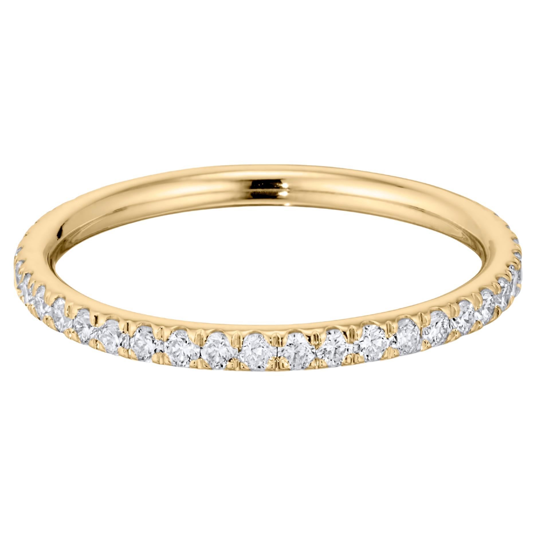 If you’re looking to find the perfect wedding band or simply something to brighten up your ring stack, our Diamond Eternity Band is super versatile. The ring is set with 0.56 carats of round brilliant-cut diamonds and mounted in 18K yellow gold. It