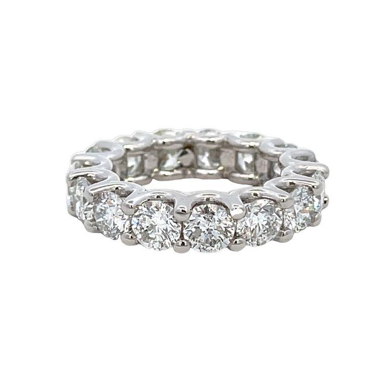 This absolutely breathtaking ring is an exquisite representation of the concept of eternal love. The intricate design features round-cut diamonds that are of G color and have S1 clarity. The diamonds weigh 7.56 carats and are arranged in a stunning