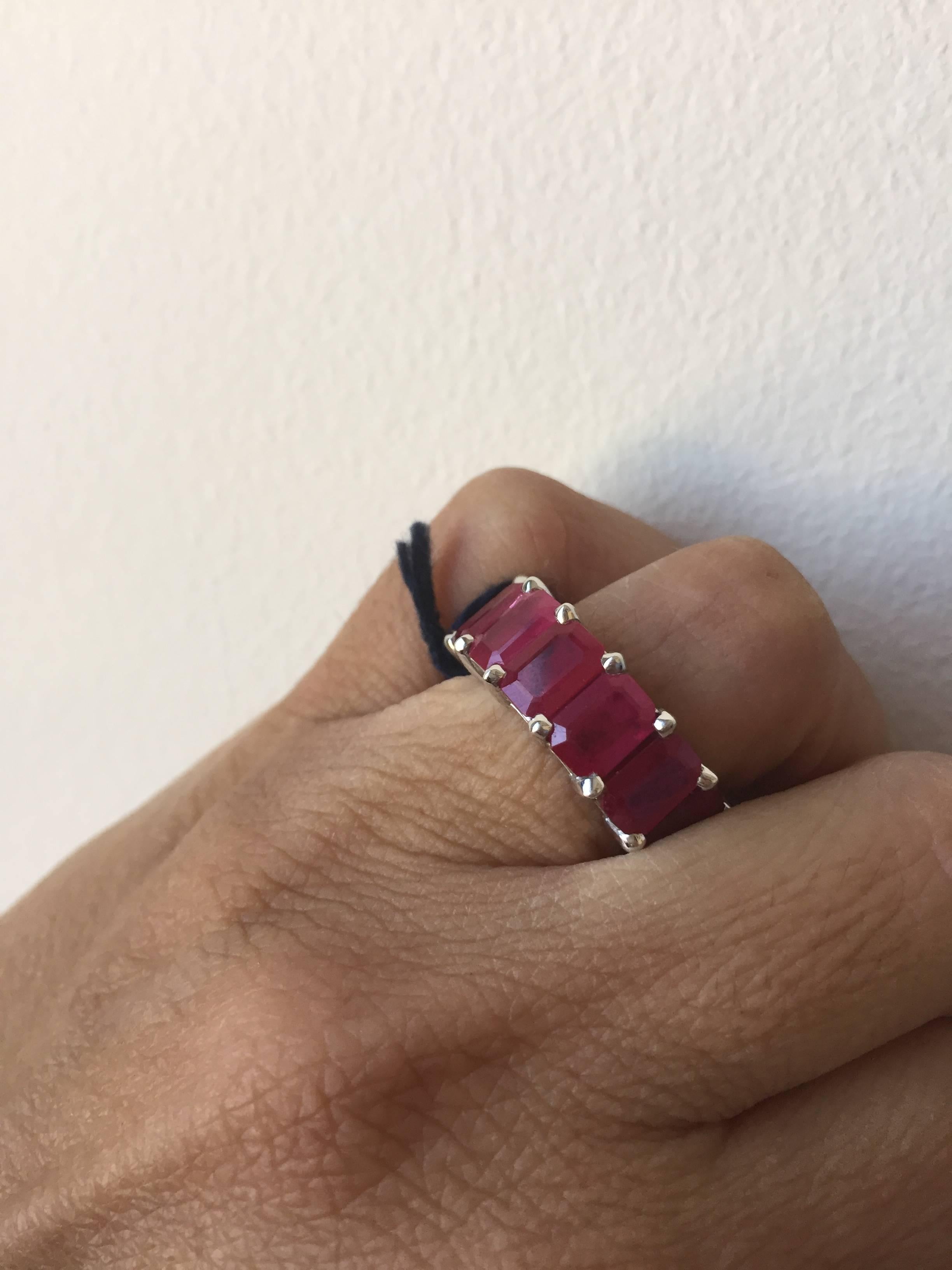 Exquisite one of a kind eternity, Burma Ruby Ring set in 14K white gold. The stones in this ring are emerald cut, each stone weighs approximately one carat. It is an absolutely stunning piece. The total weight is 11.63 carats. The ring is a size 6.
