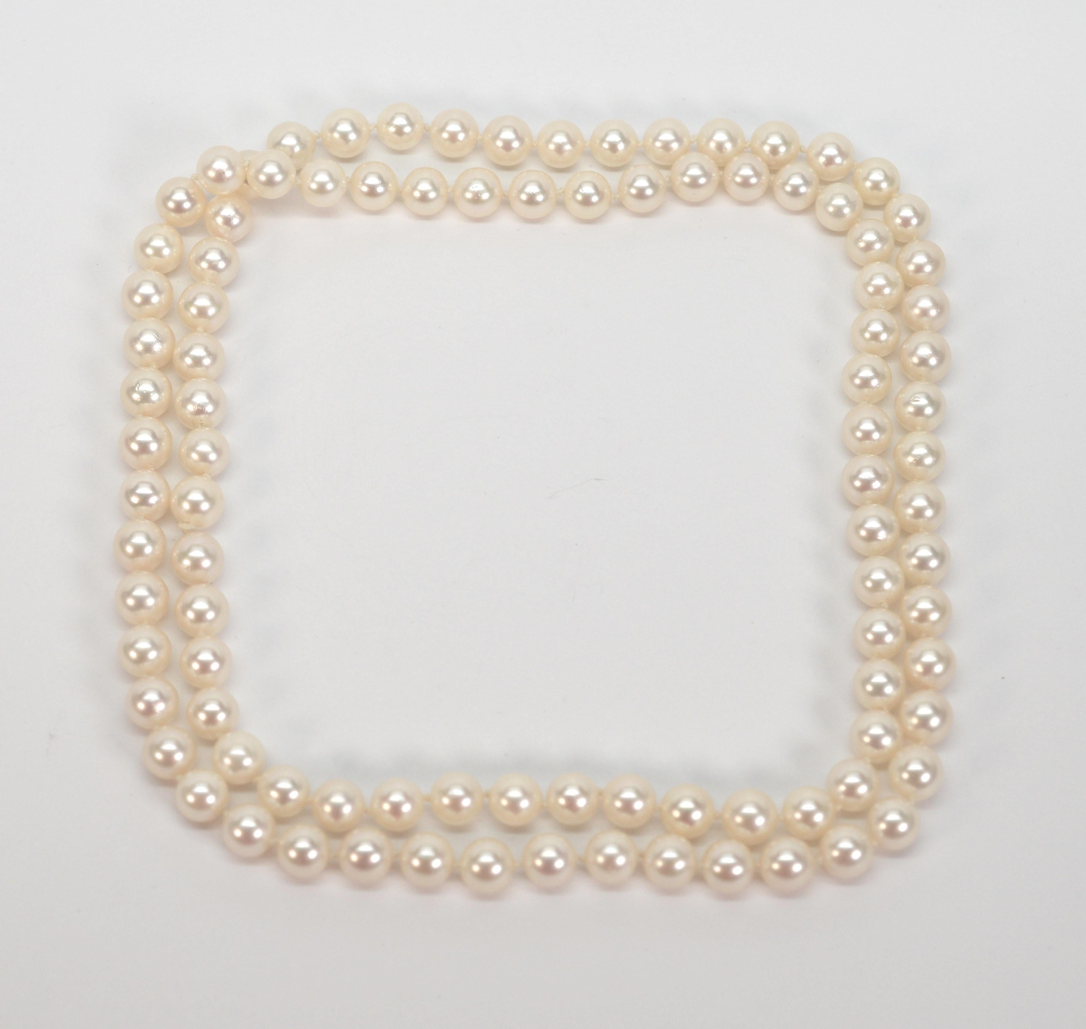 Pearls are eternal and this desirable 30 inch strand of lustrous cultured white round AA+ Akoya pearls is no exception. Always appreciated and in style, this classic pearl necklace is composed of 96 matched and hand knotted lustrous white round 7mm