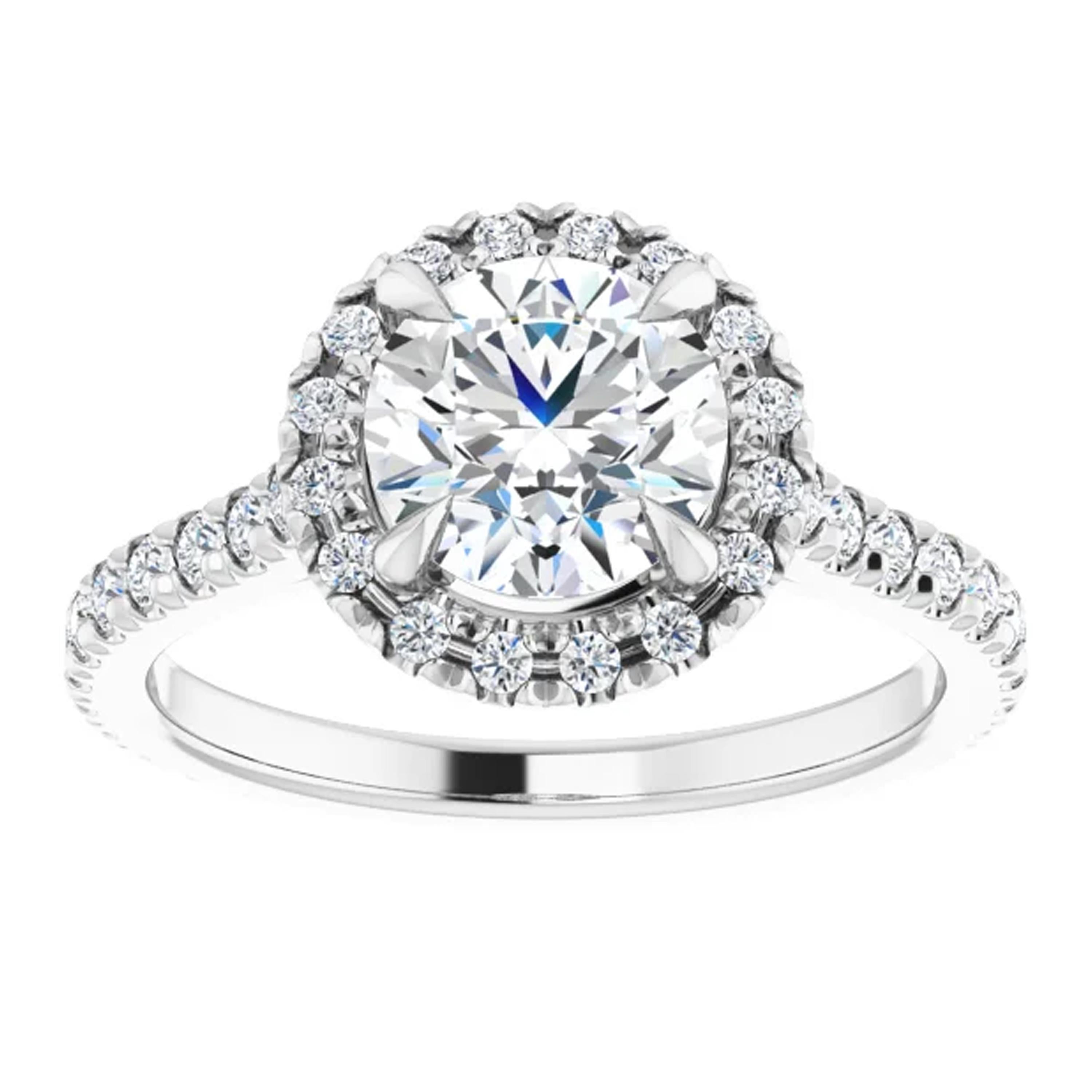 French pave diamonds with extraordinary light performance line the eternity shank of this engagement ring. Amplified by a halo of additional French pave diamonds, the round brilliant GIA certified center diamond twinkles in the center. Seal your