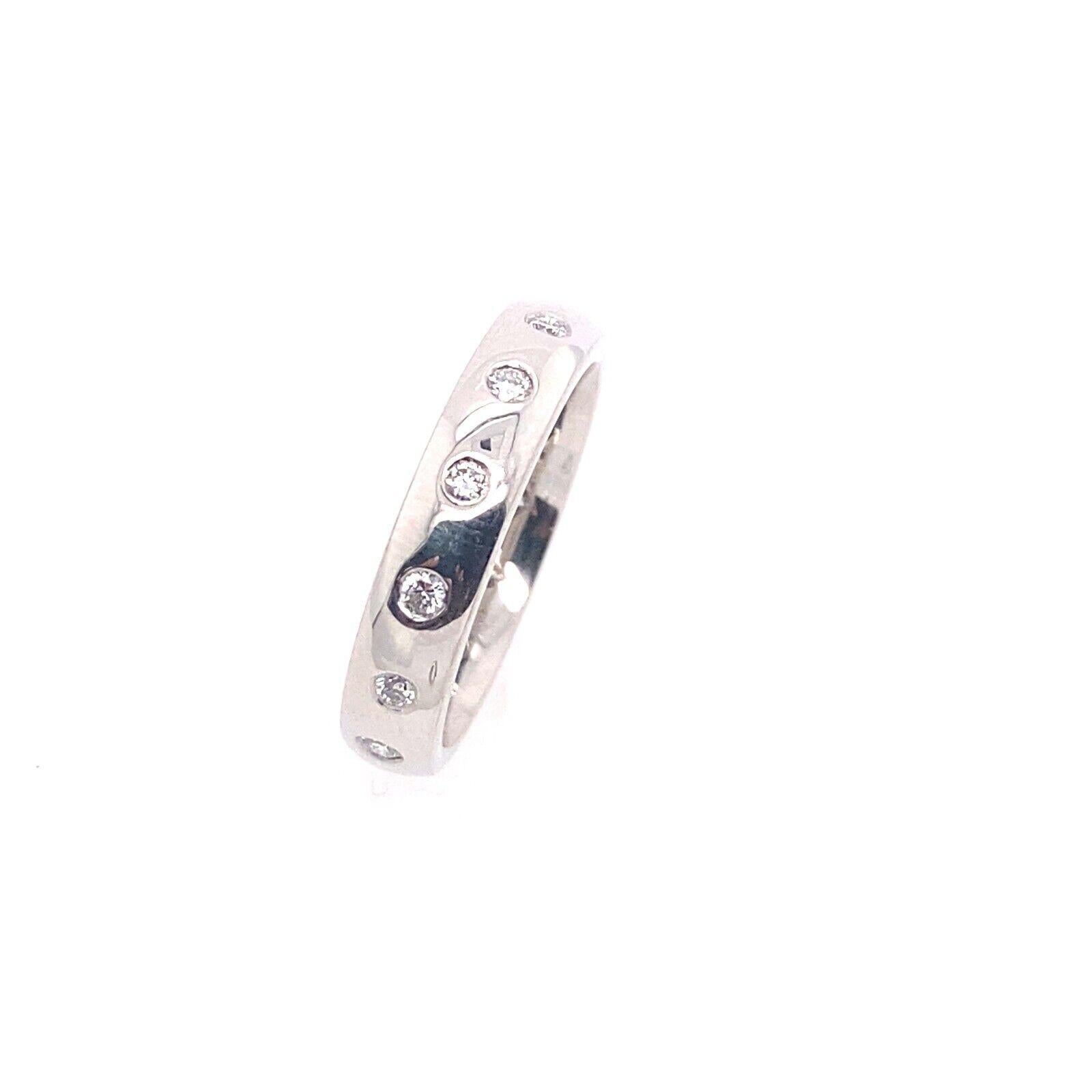 This beautiful 18ct white gold eternity/wedding band is set with 0.40ct of diamonds. The band has a total of 14 diamonds set in delicate bezel settings. It is a perfect choice for stacking with other rings or wearing on its own.

Additional