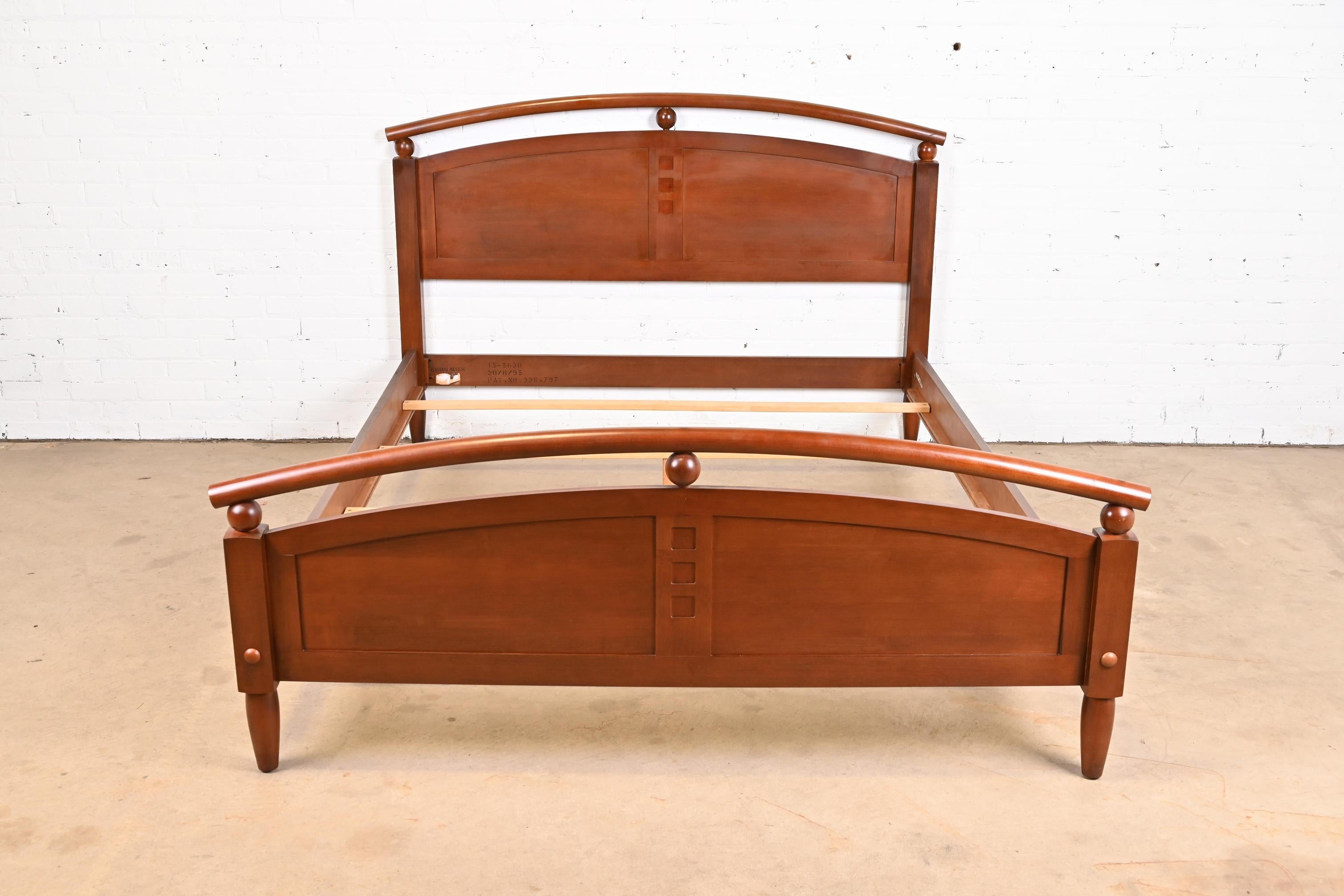 A gorgeous Modern carved cherry wood queen size bed.

By Ethan Allen, 