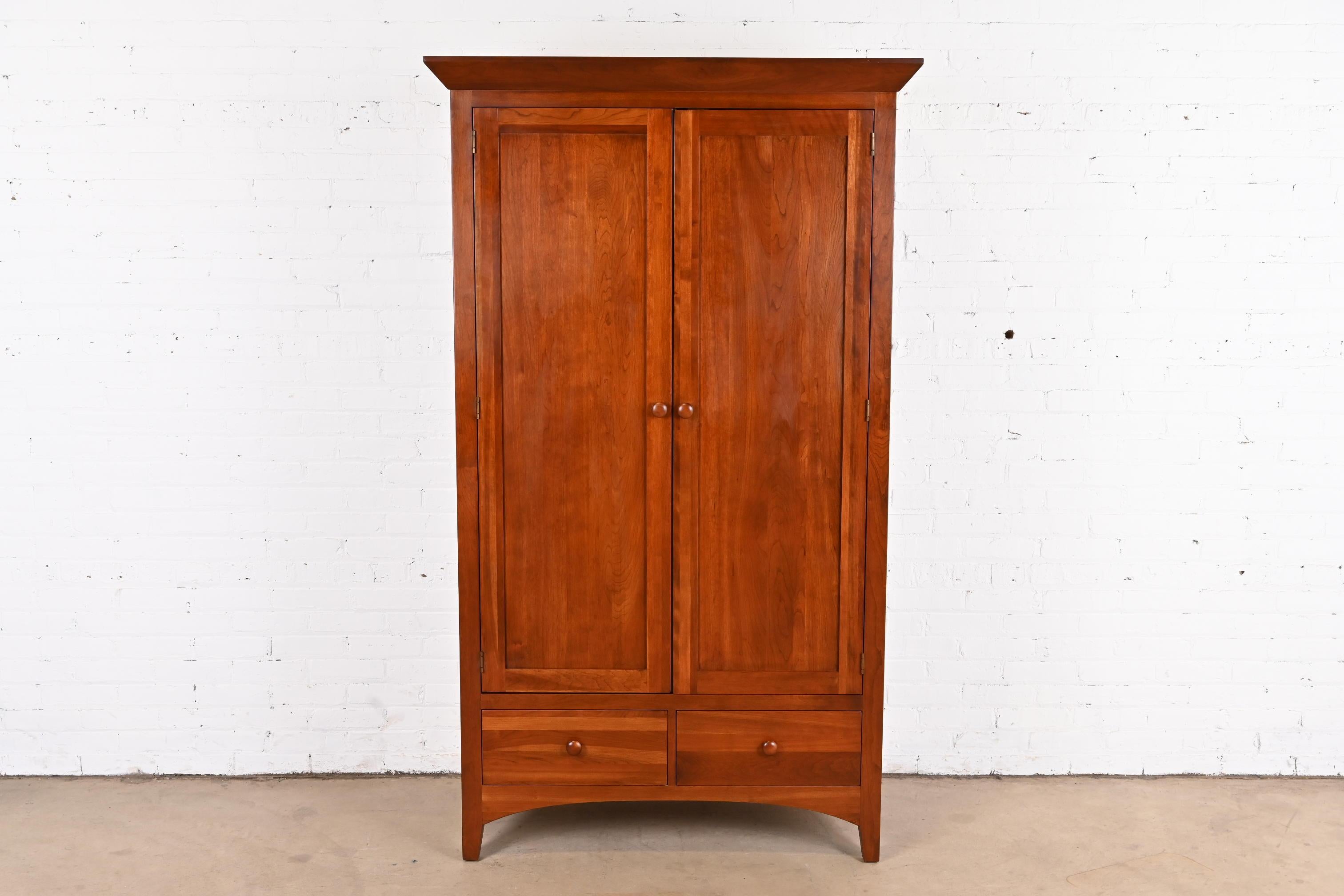 A gorgeous Mission, Arts & Crafts, or Shaker style solid cherry wood gentleman's chest or armoire dresser

USA, circa 1990s

Measures: 44