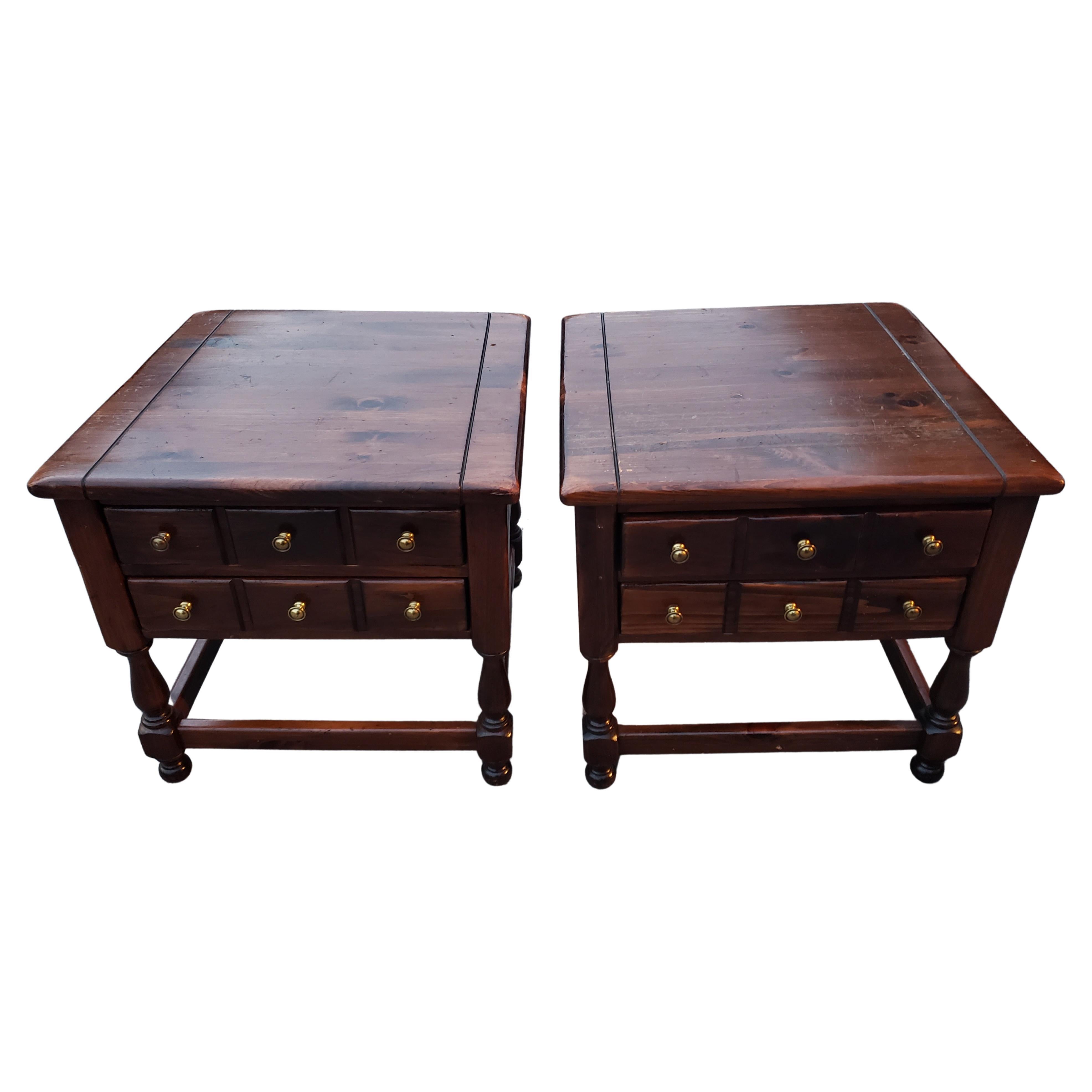 Rare pair of Ethan Allen Antique Pine Old Tavern Collection side tables. Two functional dovetailed drawers. Nice dark old pine patina. Good vintage condition. Wear appropriate with age and normal use. Measurements are 25