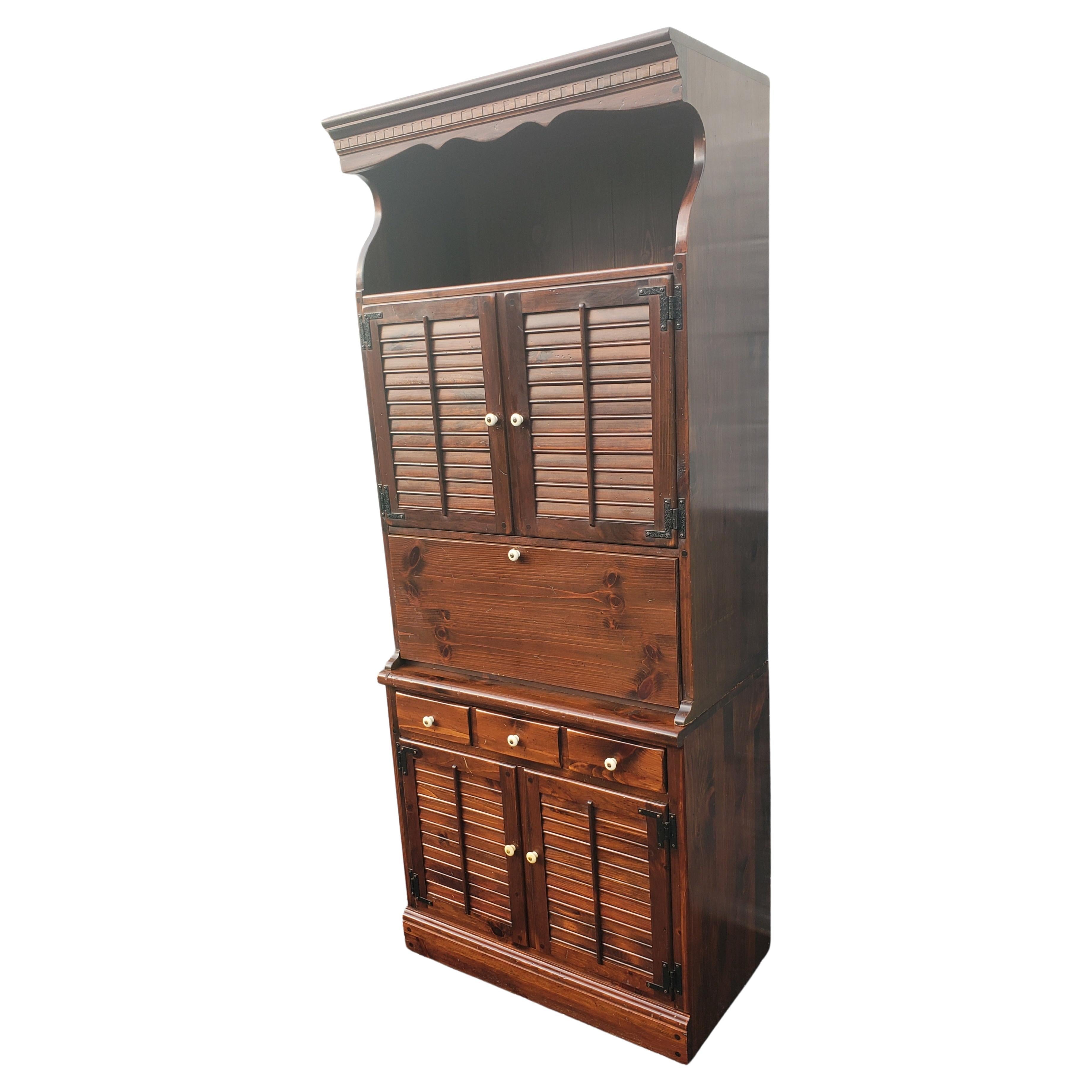 Beautiful Ethan Allen Antiqued Pine lighted Cabinet with hutch. Hutch just seat on the base cabinet and can be used as a separate piece of furniture for displaying or as a bookcase. The base cabinet is has a large storage area under a single drawer.