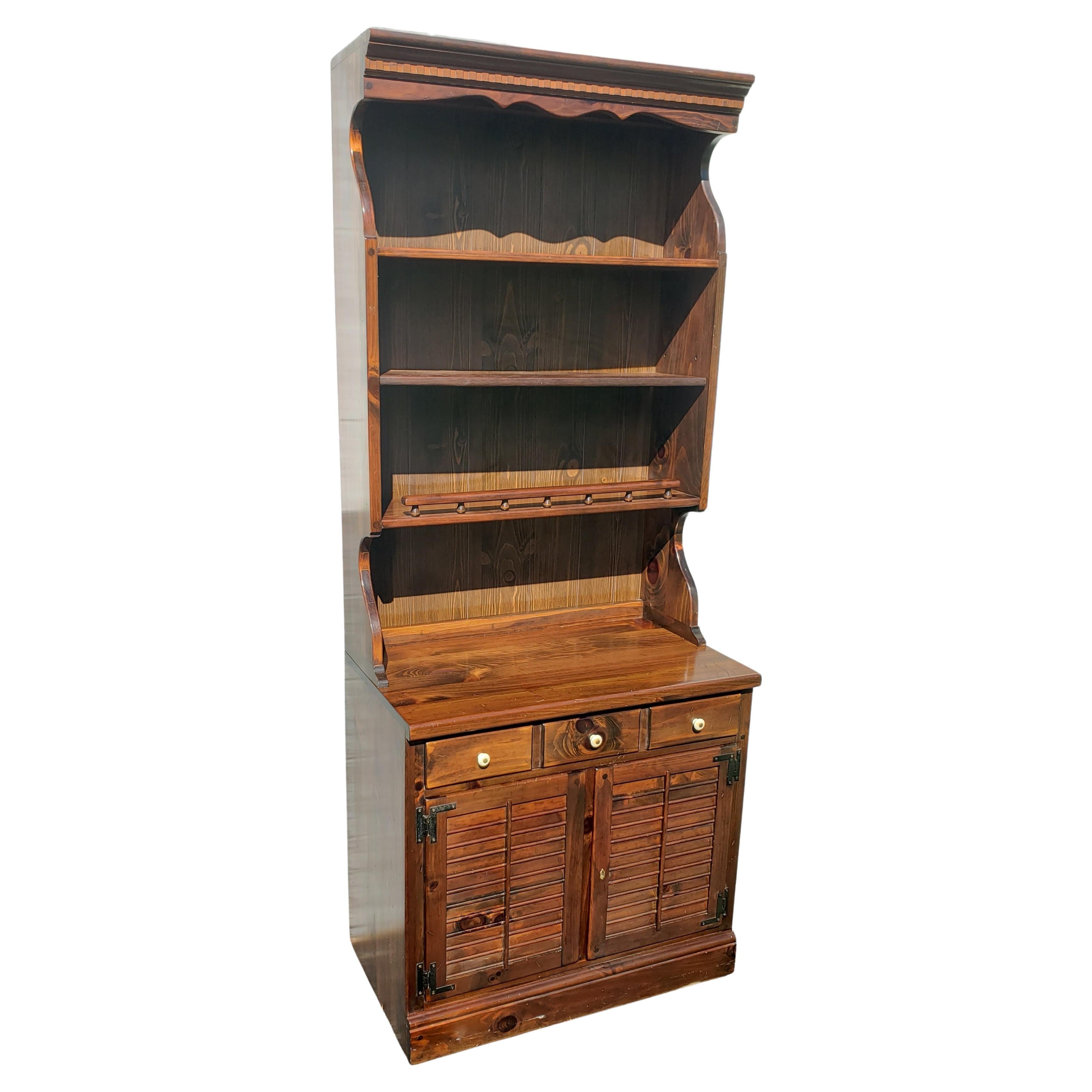 Beautiful Ethan Allen Antiqued Pine Old Tavern cabinet with hutch. Hutch just seat on the base cabinet and can be use as a separate piece of furniture for displaying or as a bookcase. The base cabinet is compartmented to store liquor, wine bottles