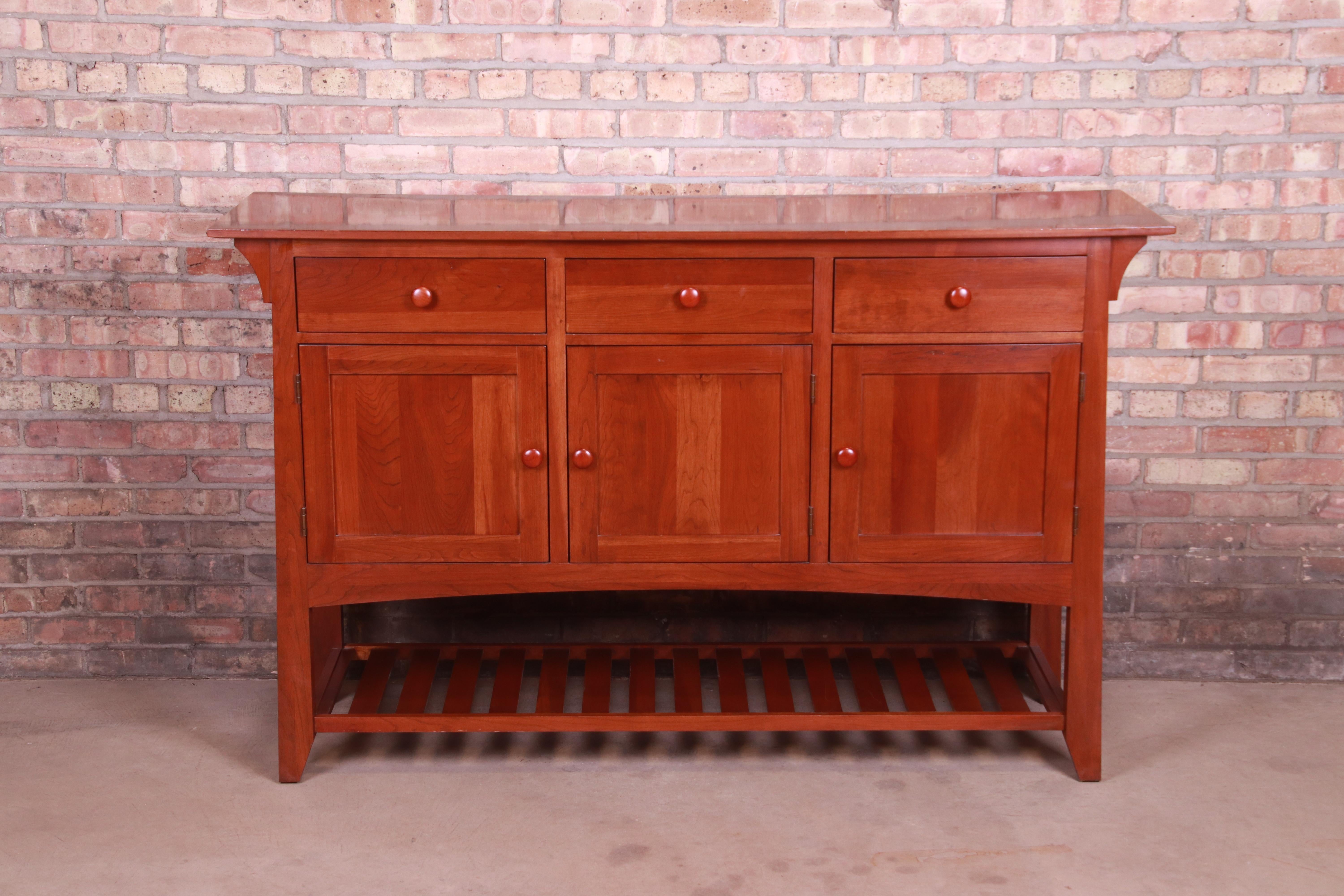 A gorgeous Arts & Crafts or Shaker style cherry wood sideboard or credenza

By Ethan Allen

USA, circa 1990s

Measures: 64.63