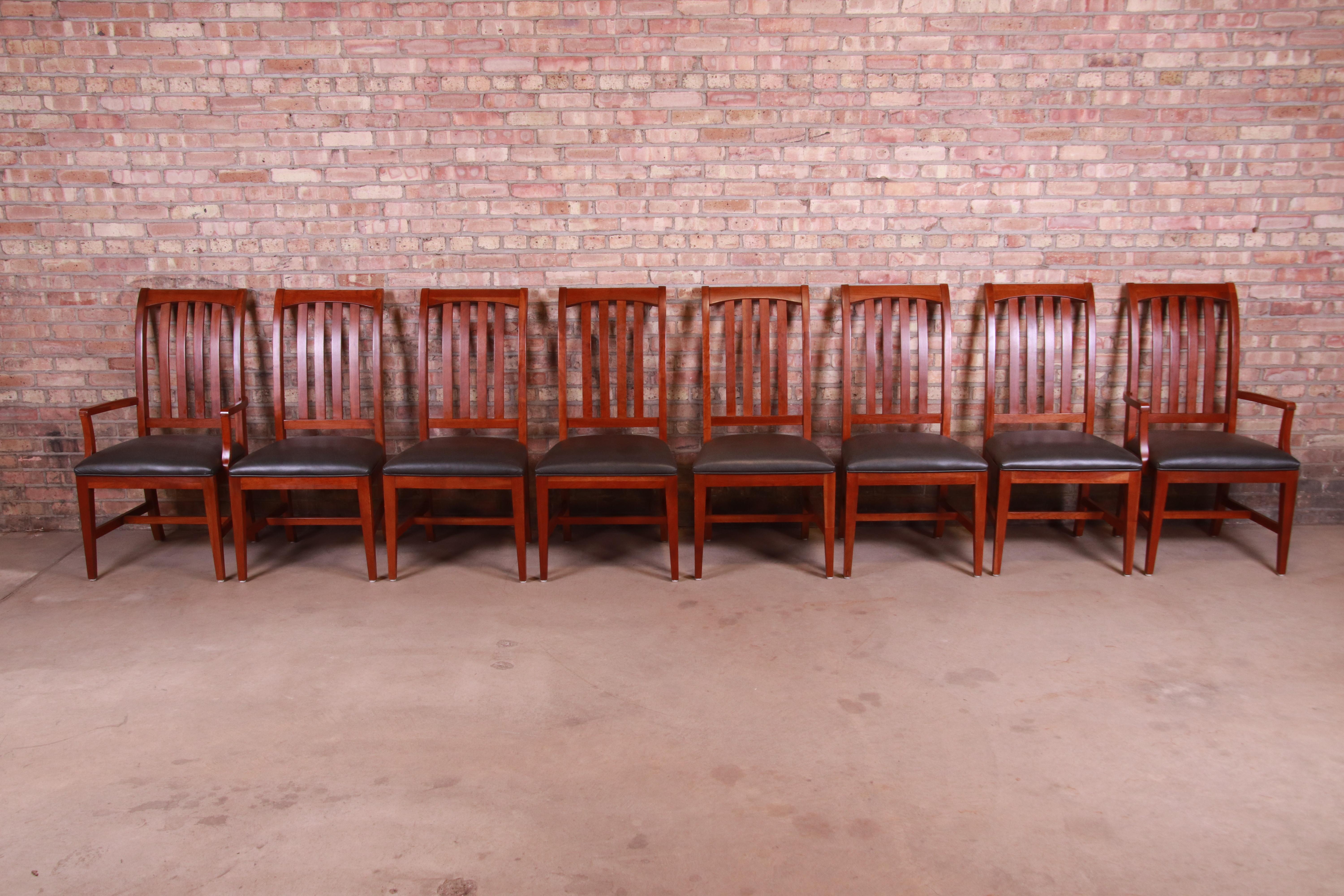 A gorgeous set of eight Arts & Crafts or shaker style slat back dining chairs

By Ethan Allen

USA, circa 1990s

Solid cherry wood frames, with original charcoal gray leather upholstered seats.

Measures:
Arm chairs - 22.88