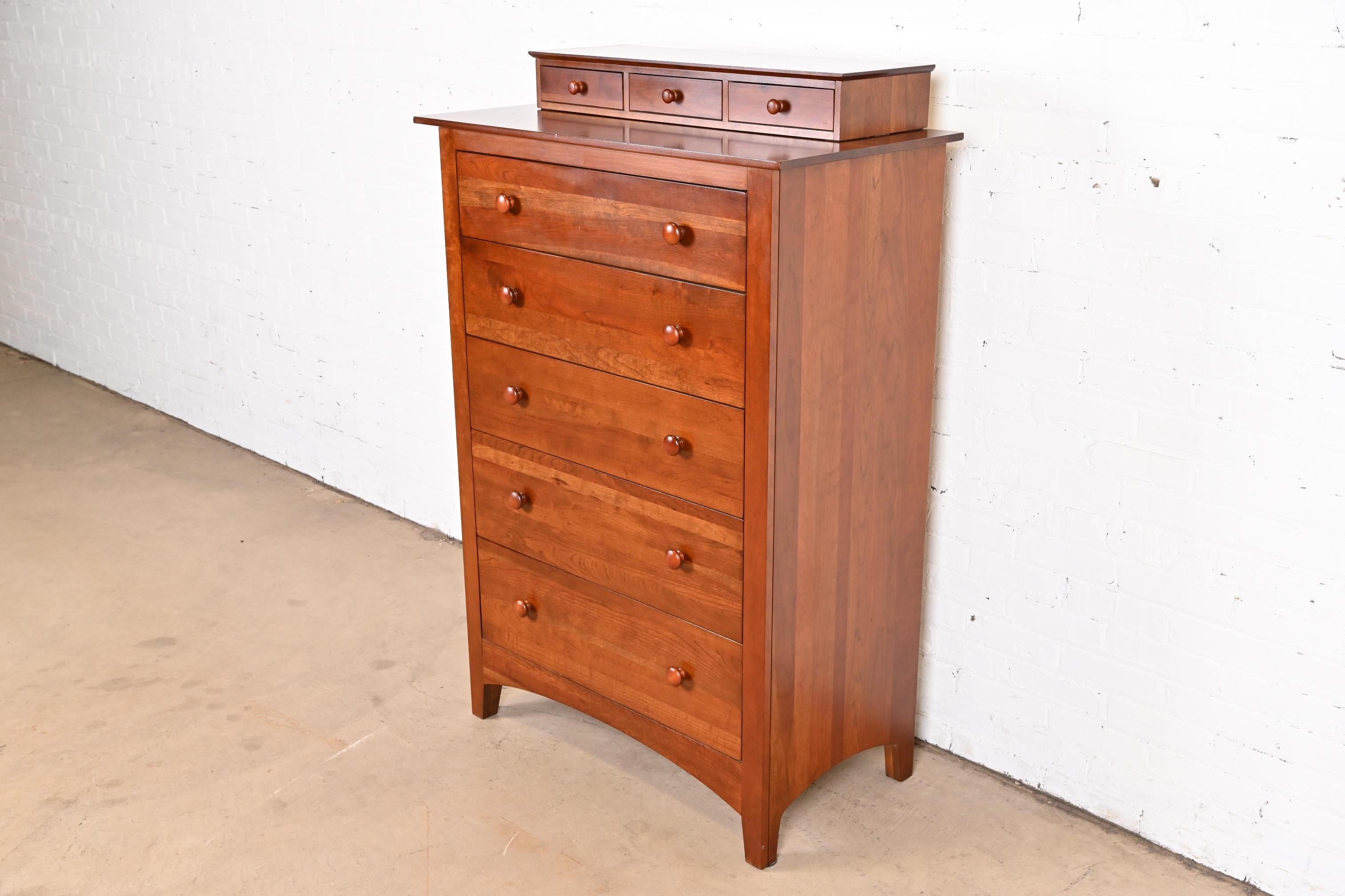 A gorgeous Mission, Arts & Crafts, or Shaker style solid cherry wood eight-drawer highboy dresser or chest of drawers

By Ethan Allen

USA, circa late 20th century

Measures: 36