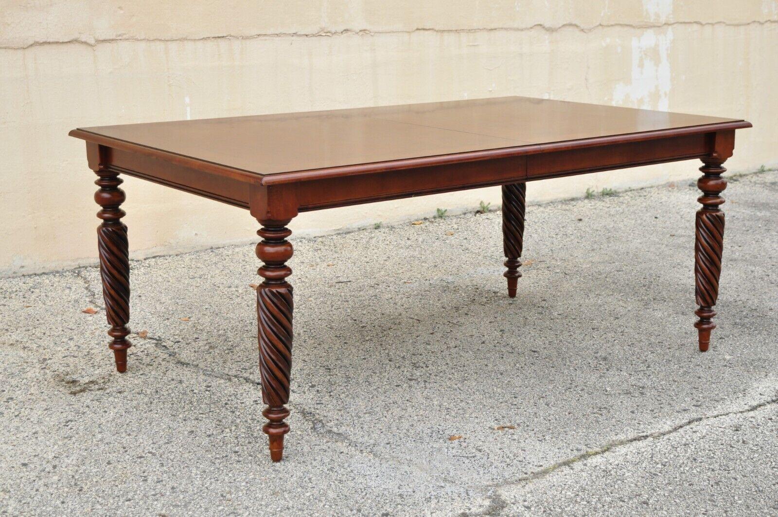 Ethan Allen British classics cherry wood rectangular dining table. Item features spiral carved legs, banded top, beautiful wood grain, original label, great style and form. Circa 2008. Measurements: 31
