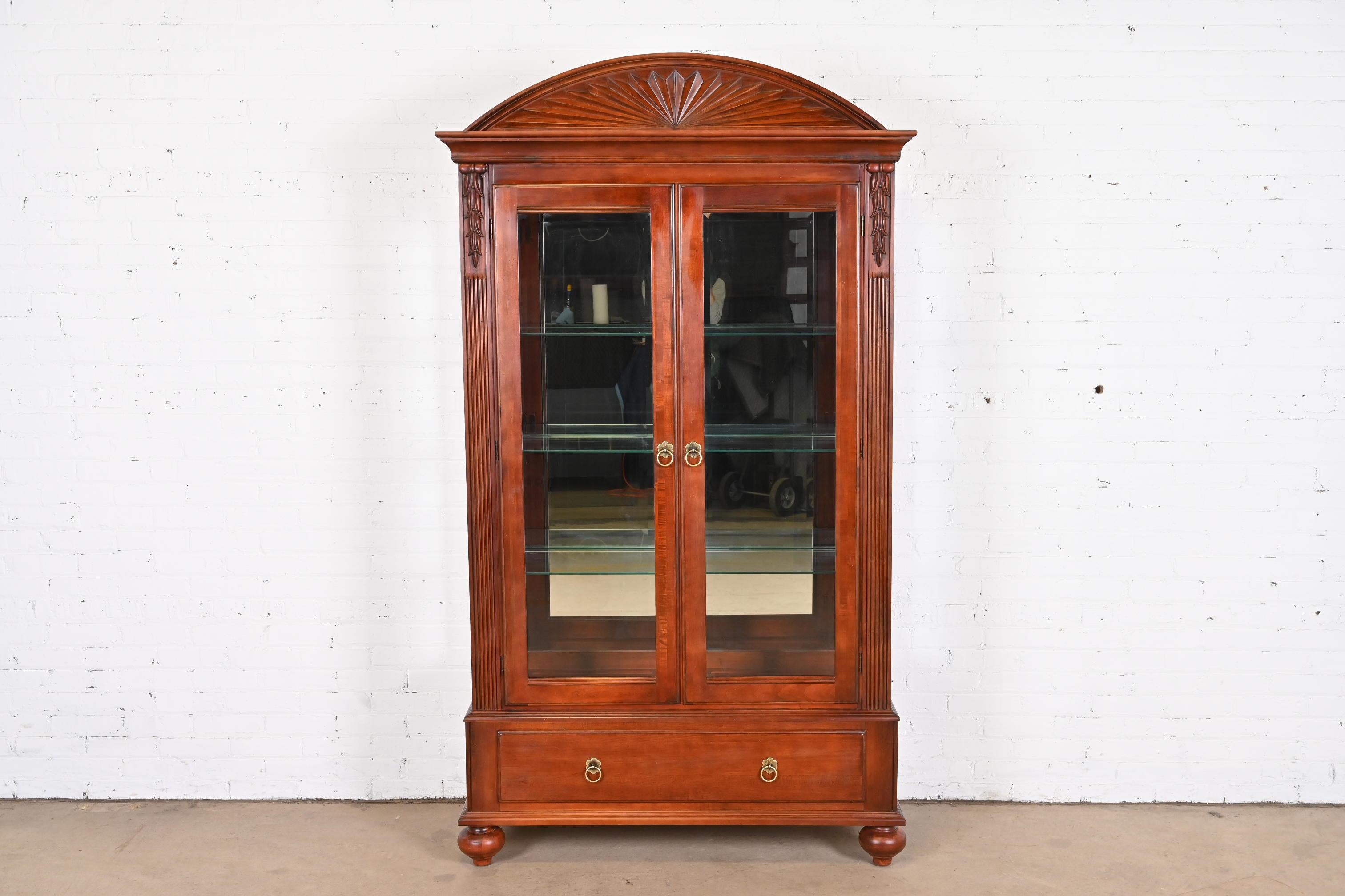 A gorgeous British Colonial style lighted bookcase, display cabinet, or china cabinet

By Ethan Allen, 