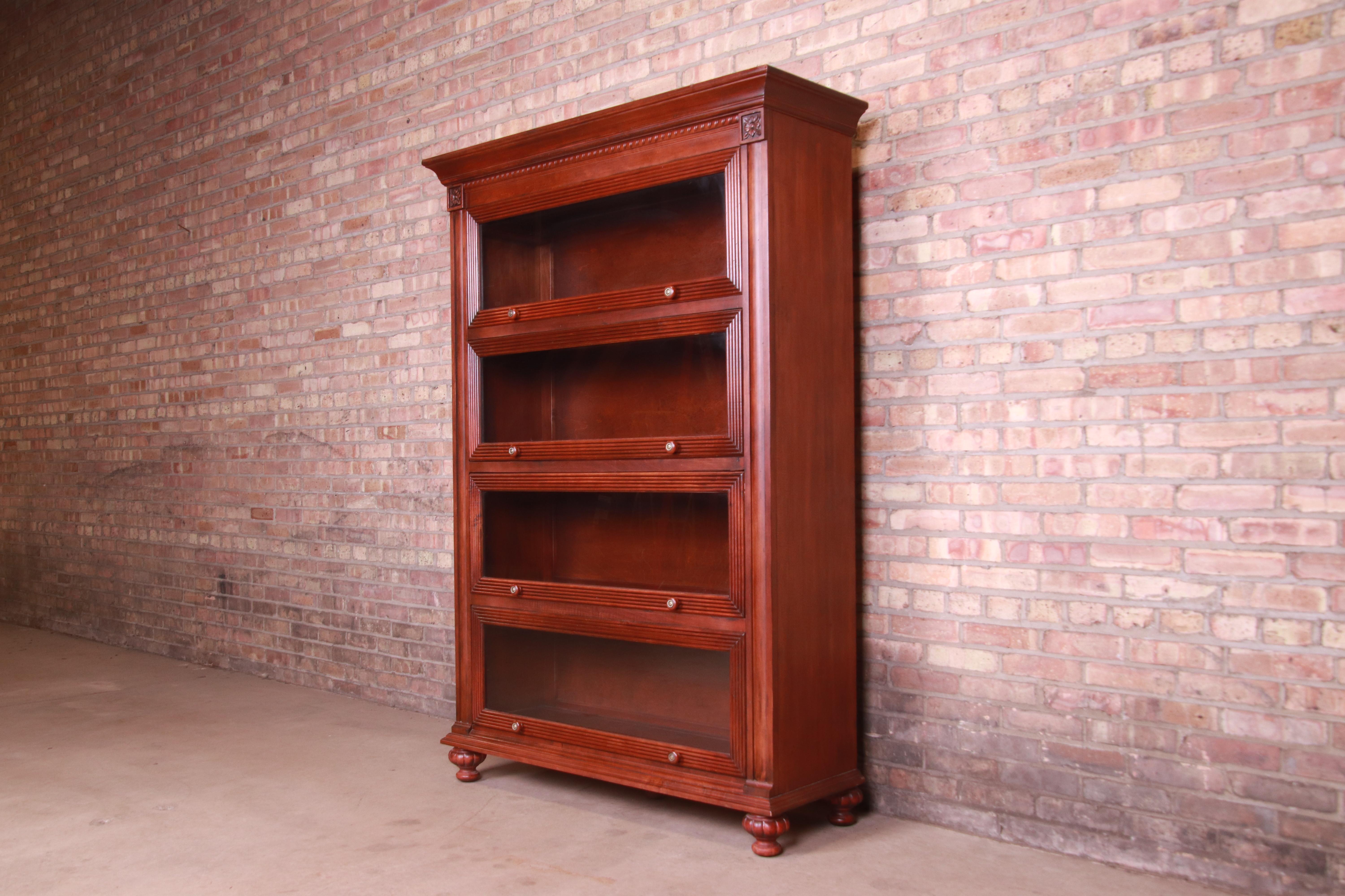 A gorgeous carved mahogany barrister bookcase

By Ethan Allen

USA, Circa 1990s

Measures: 50