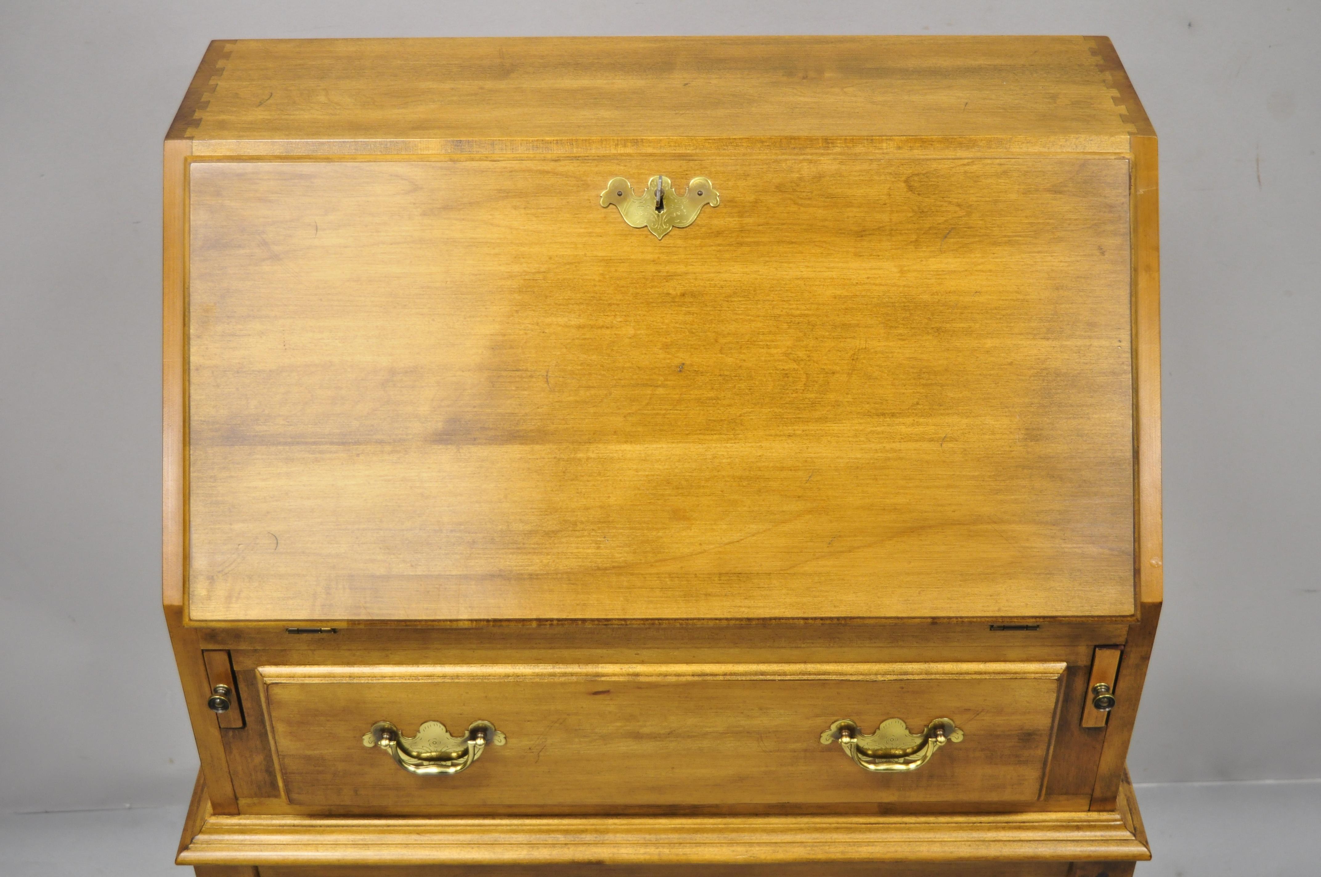 Ethan Allen circa 1776 maple drop lid slant front secretary desk. Item features solid wood construction, beautiful wood grain, original stamp, working lock and key, 1 dovetailed drawer, solid brass hardware, very nice vintage item, quality American