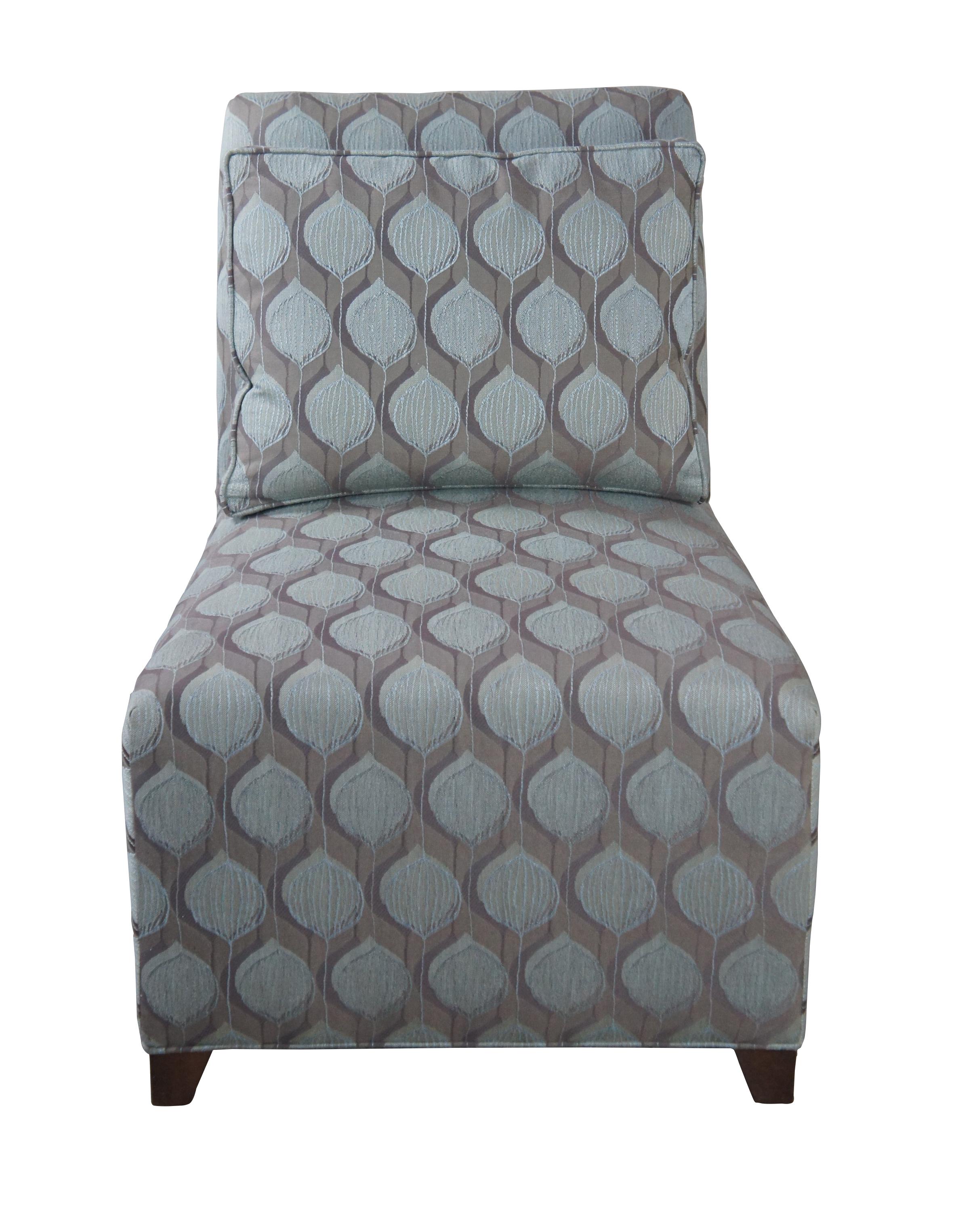 An Ethan Allen transitional slipper chair. Features a geometric fabric with lumbar bolster pillow. The chair is supported by square tapered feet. #20-7537