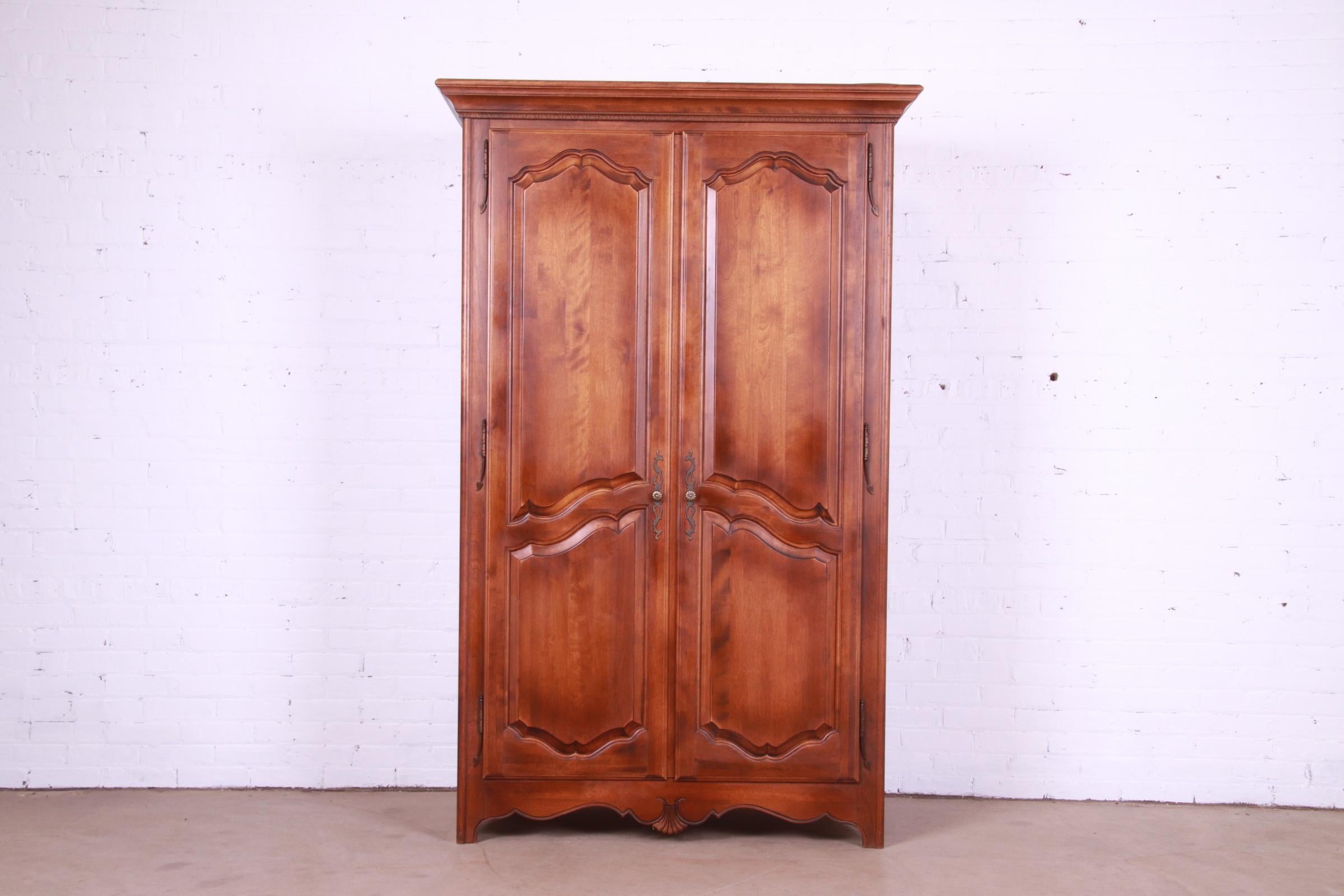 A gorgeous French Provincial Louis XV style armoire dresser

By Ethan Allen

USA, Circa 1990s

Solid carved birch wood, with original brass hardware.

Measures: 48