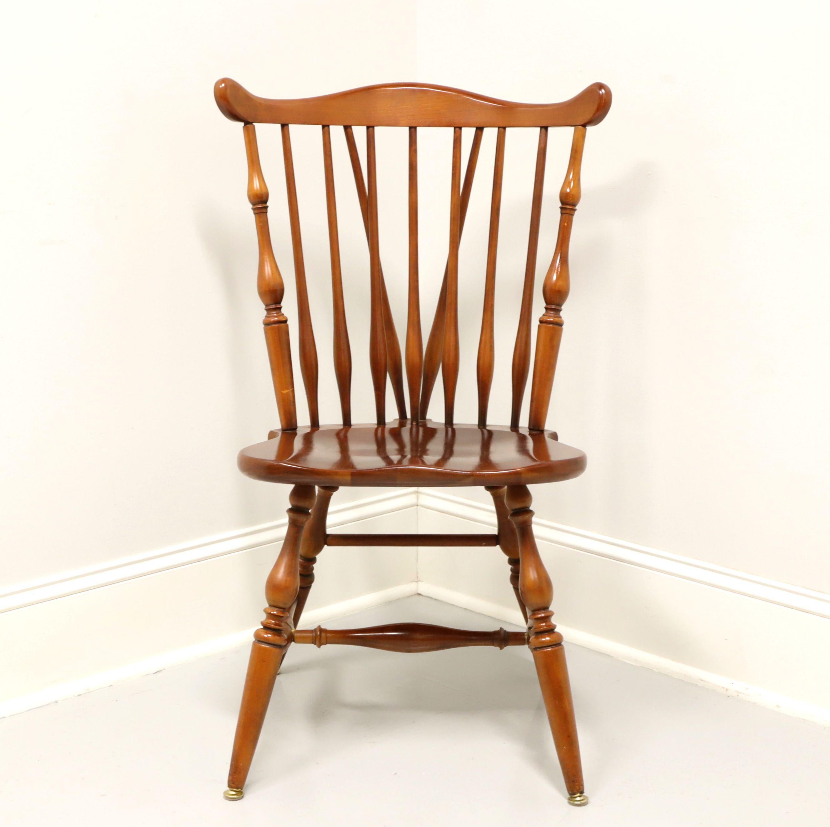 A Windsor style dining side chair by Ethan Allen, their Duxbury. Solid maple, fiddleback with turned side spindles, saddle shape seat, tail-supports with spindles, turned legs and stretchers. Made in the USA, in the mid 20th Century.

Style #: 