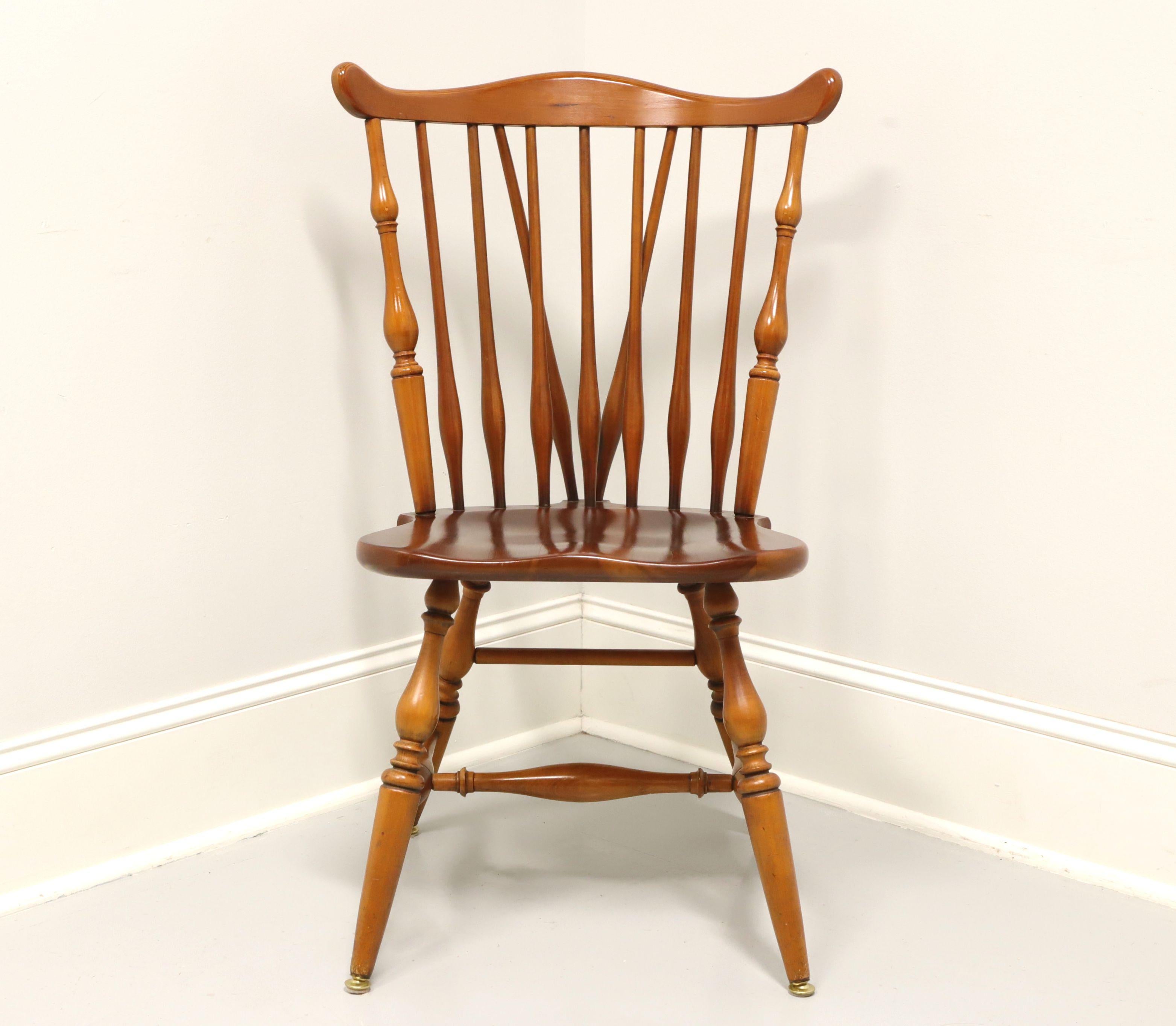 A Windsor style dining side chair by Ethan Allen, their Duxbury. Solid maple, fiddleback with turned side spindles, saddle shape seat, tail-supports with spindles, turned legs and stretchers. Made in the USA, in the mid 20th Century.

Style #:
