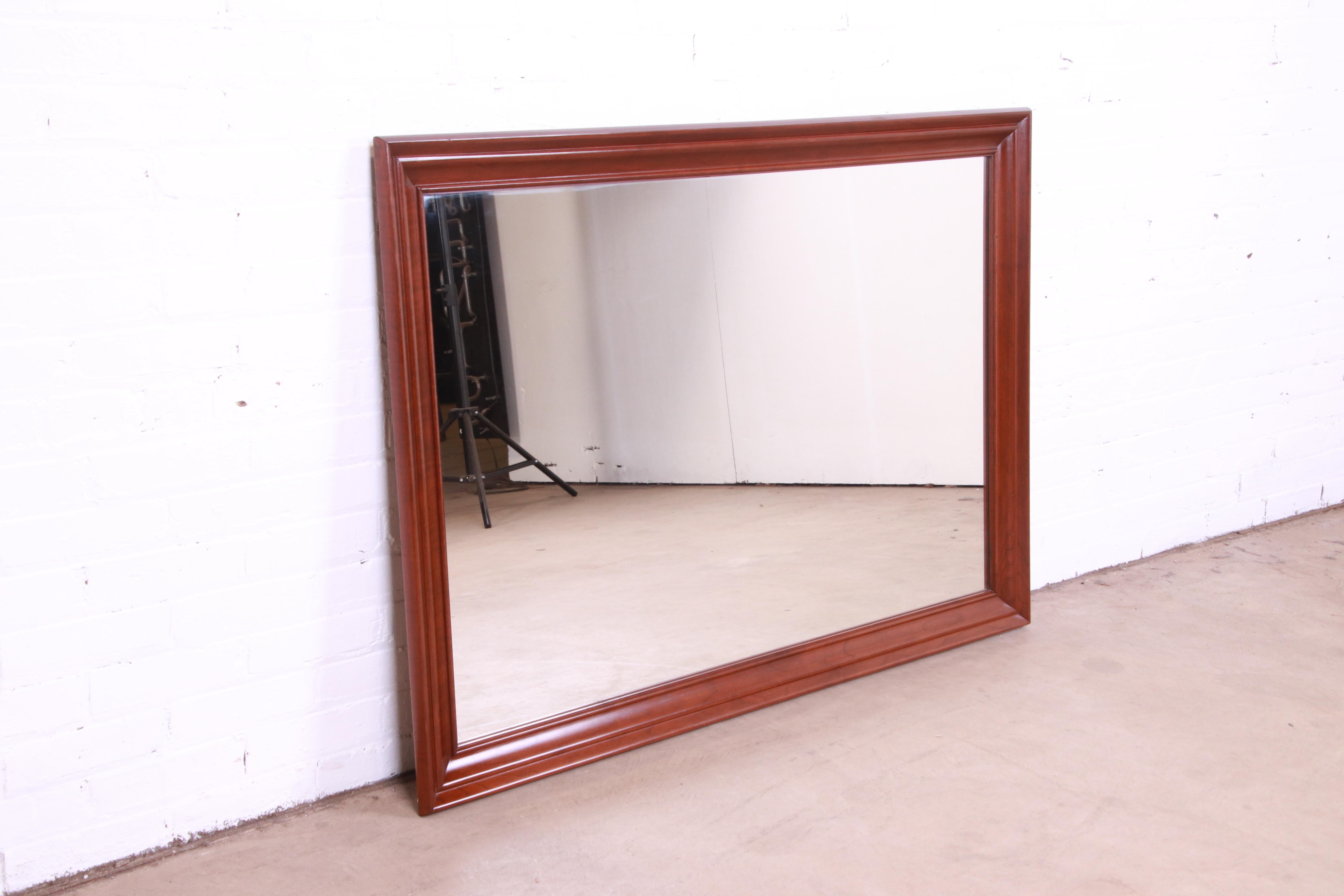 A gorgeous American Colonial solid cherry wood framed wall mirror

By Ethan Allen, 