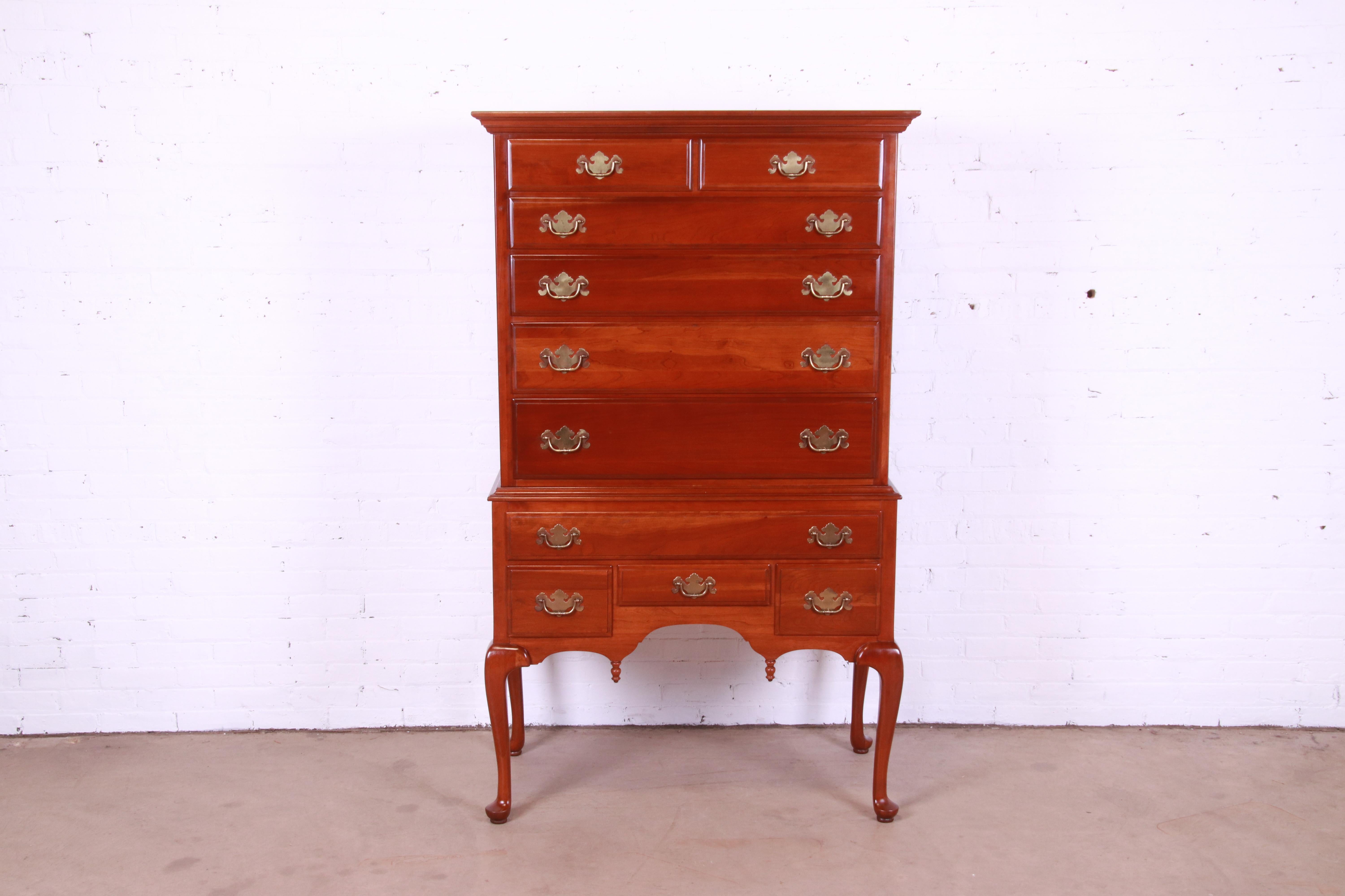 A gorgeous Queen Anne style ten-drawer highboy dresser chest.

USA, Mid-20th Century

Solid cherry wood, with original brass hardware.

Measures: 40