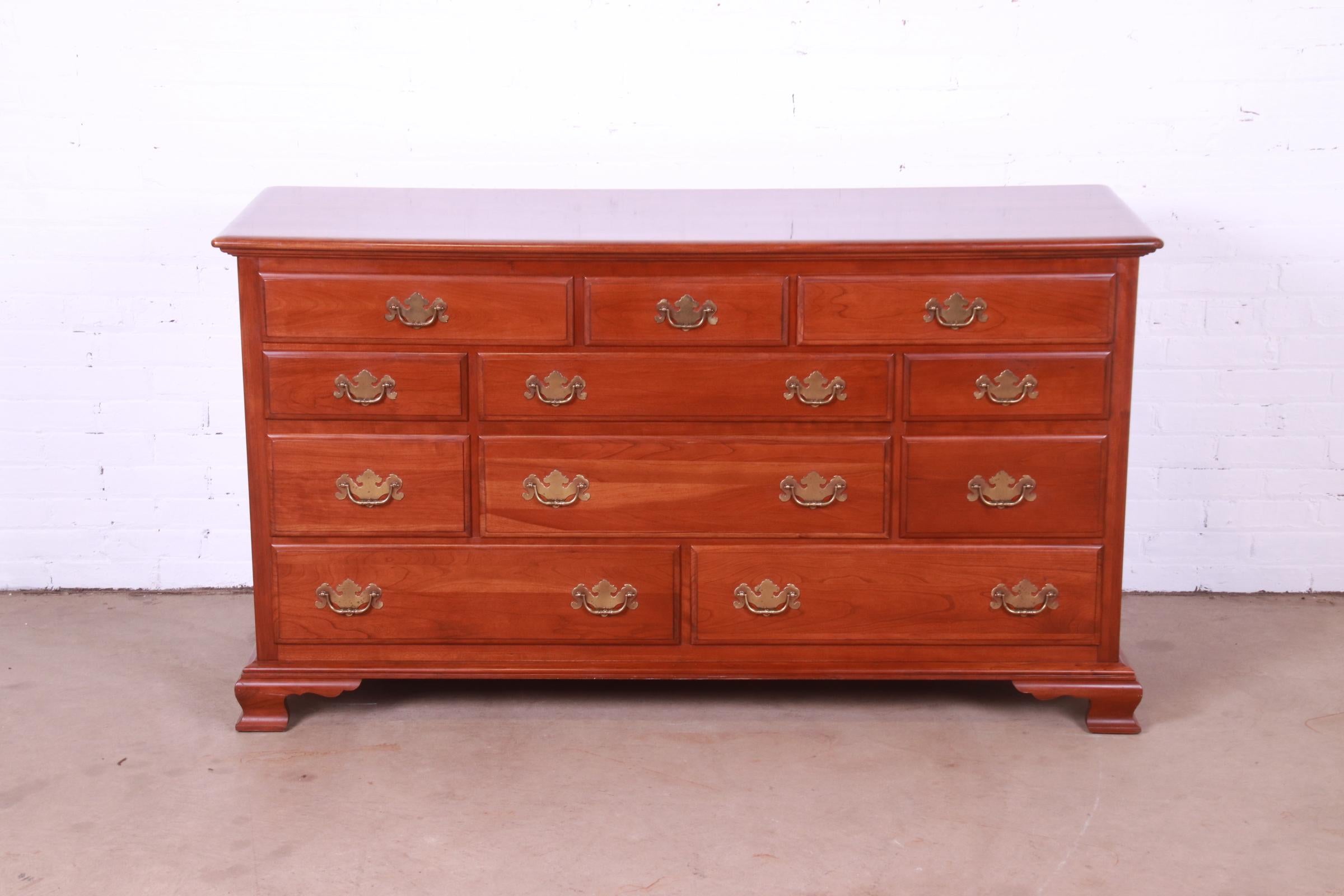 A gorgeous American Colonial or Chippendale style eleven-drawer dresser or chest of drawers

By Ethan Allen, 