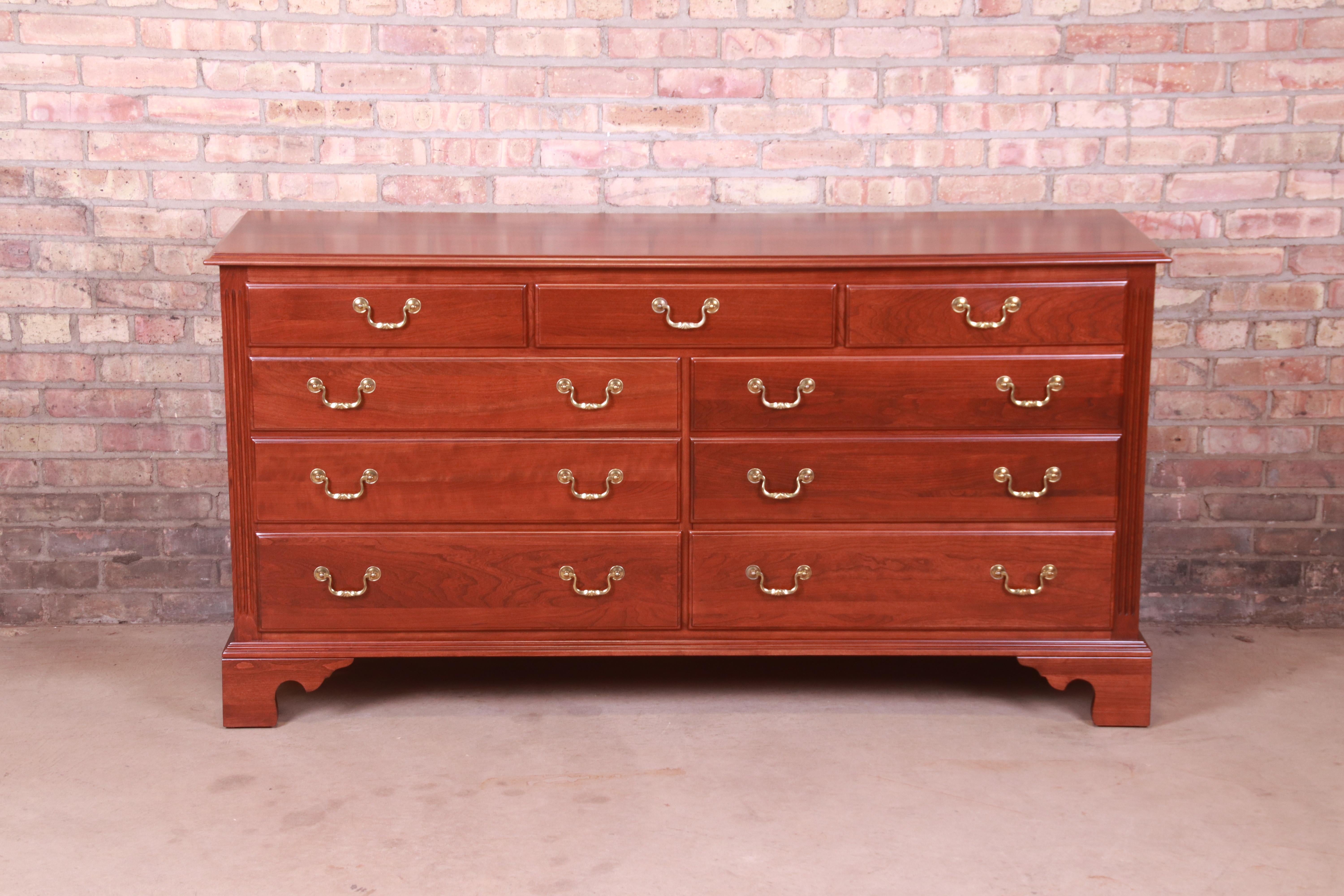 A gorgeous Georgian or Chippendale style seven-drawer dresser or credenza

USA, 1990s

Solid cherry wood, with original brass hardware.

Measures: 63.75