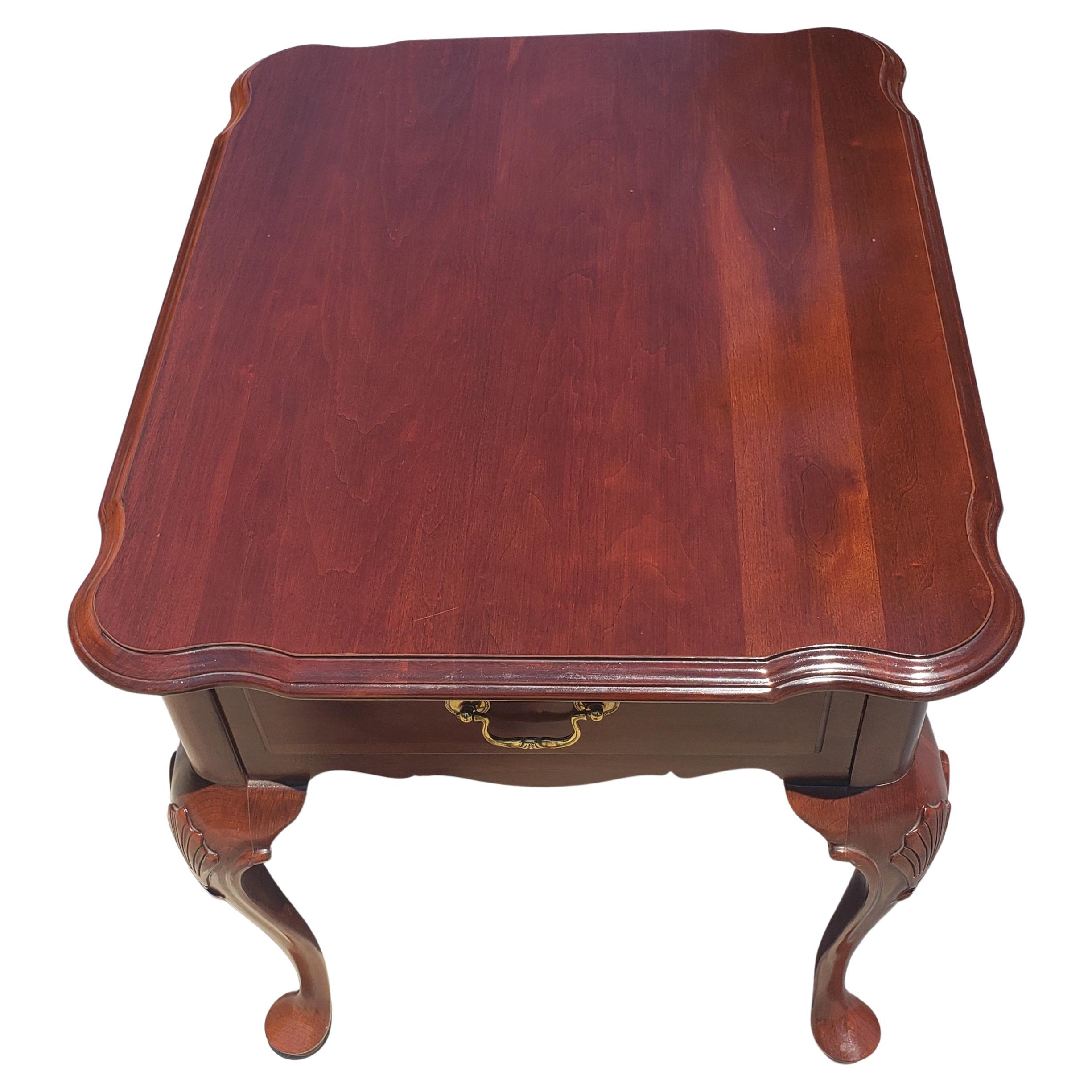 A beautiful Ethan Allen Georgian Court Queen Anne style cherry side table in very good vintage condition. 
Cabriole legs with carvings and terminating queen Anne pad feet. Very Minor signs of use.
Measures 20.5 inches in width, 26.5 inches in