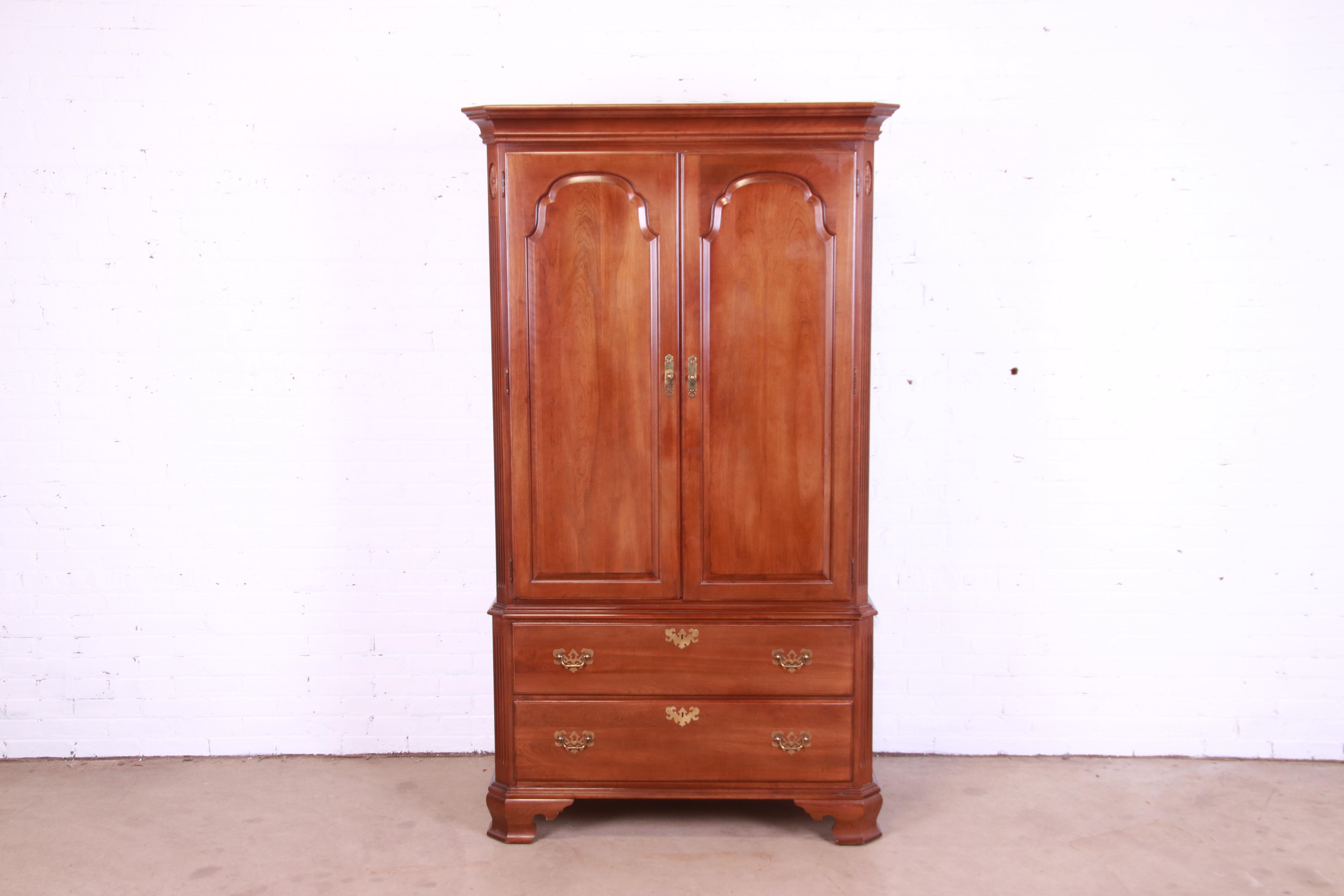 A gorgeous Georgian gentleman's chest, highboy, or armoire dresser

By Ethan Allen

USA, Circa 1980s

Carved solid cherry wood, with original brass hardware.

Measures: 44.75